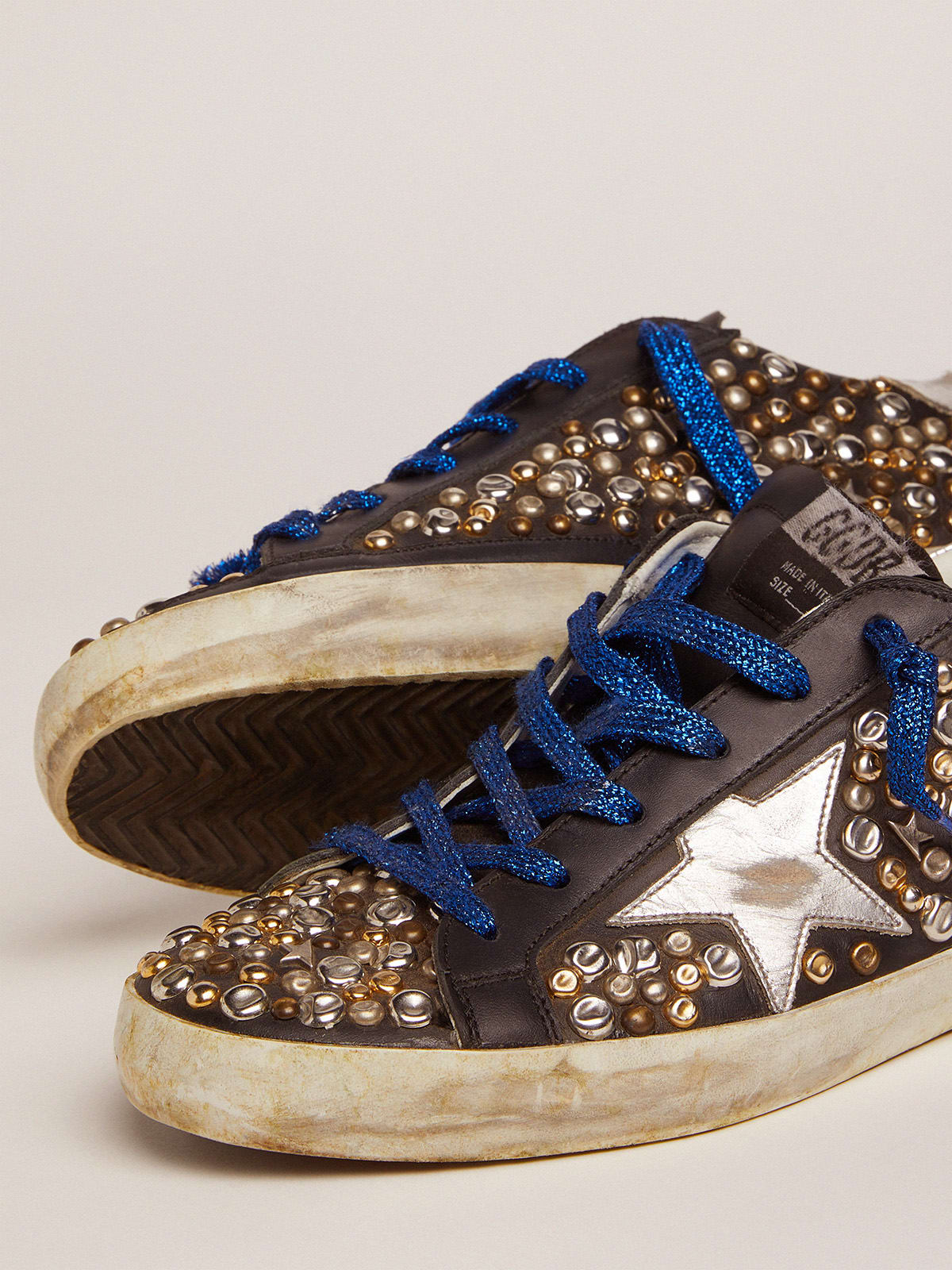 Super-Star sneakers in black leather with hammered studs and silver ...
