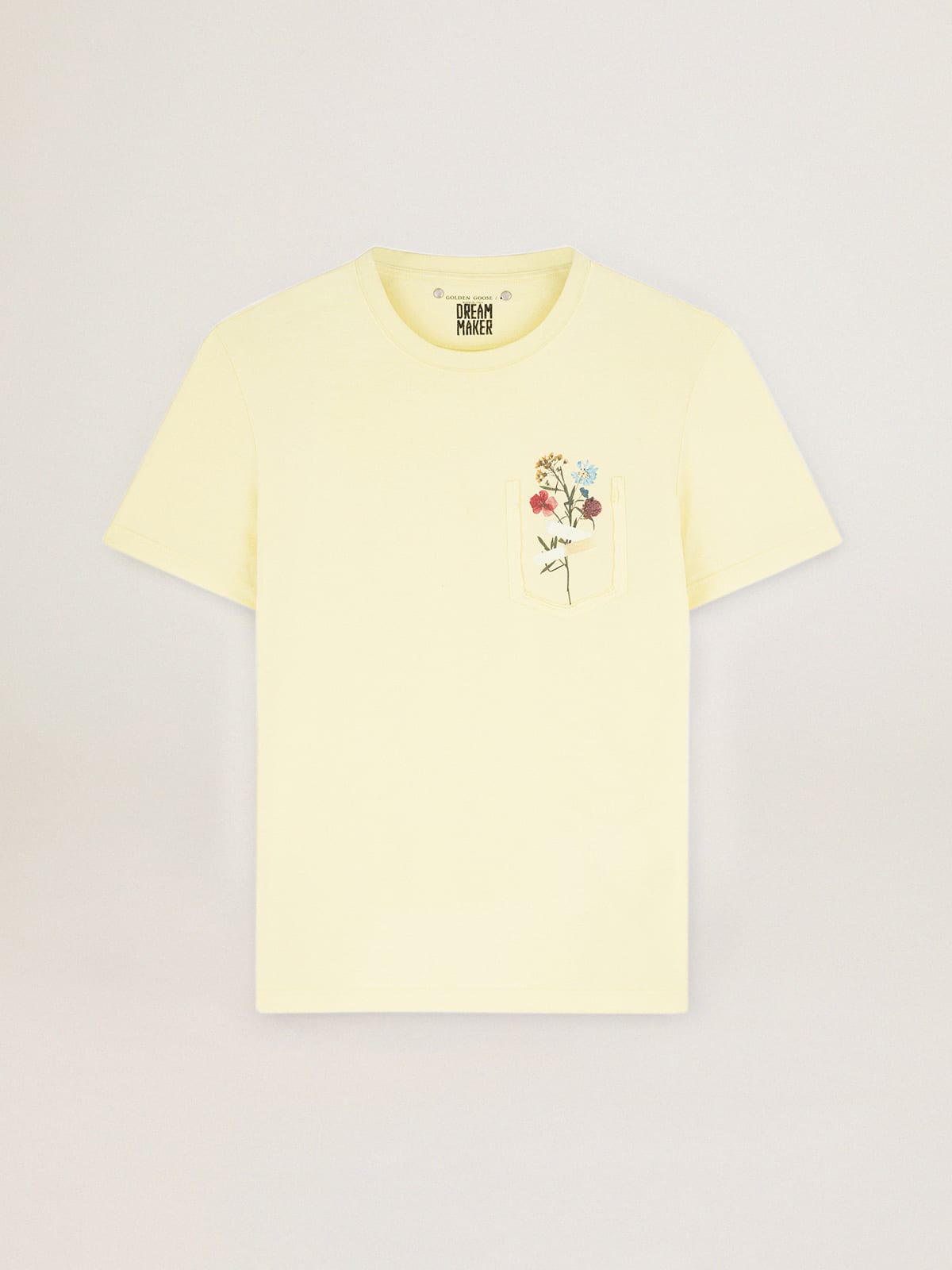 Pastel yellow T shirt with floral bouquet on the breast pocket