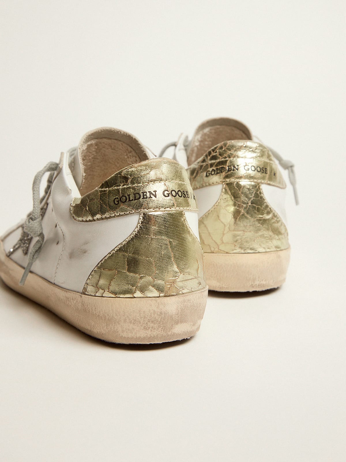 Super-Star sneakers with silver glitter star and glossy gold leather heel  tab | Golden Goose
