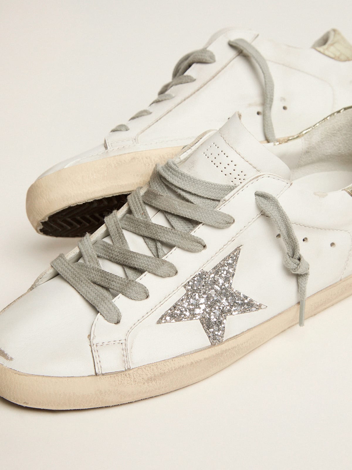 Super-Star sneakers with silver glitter star and glossy gold leather 