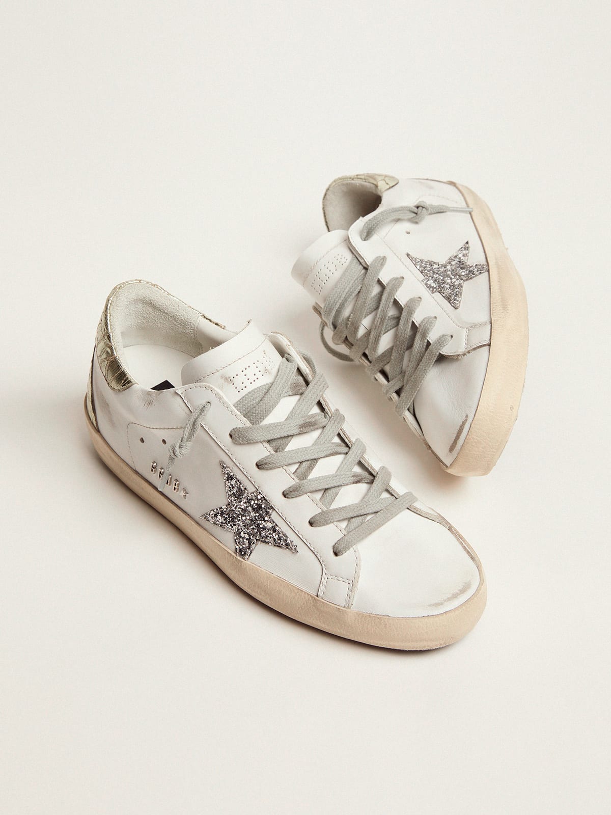 Super-Star sneakers with silver glitter star and glossy gold leather heel  tab | Golden Goose