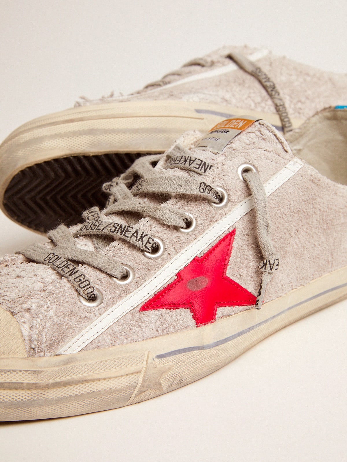 V Star sneakers in white suede with red leather star