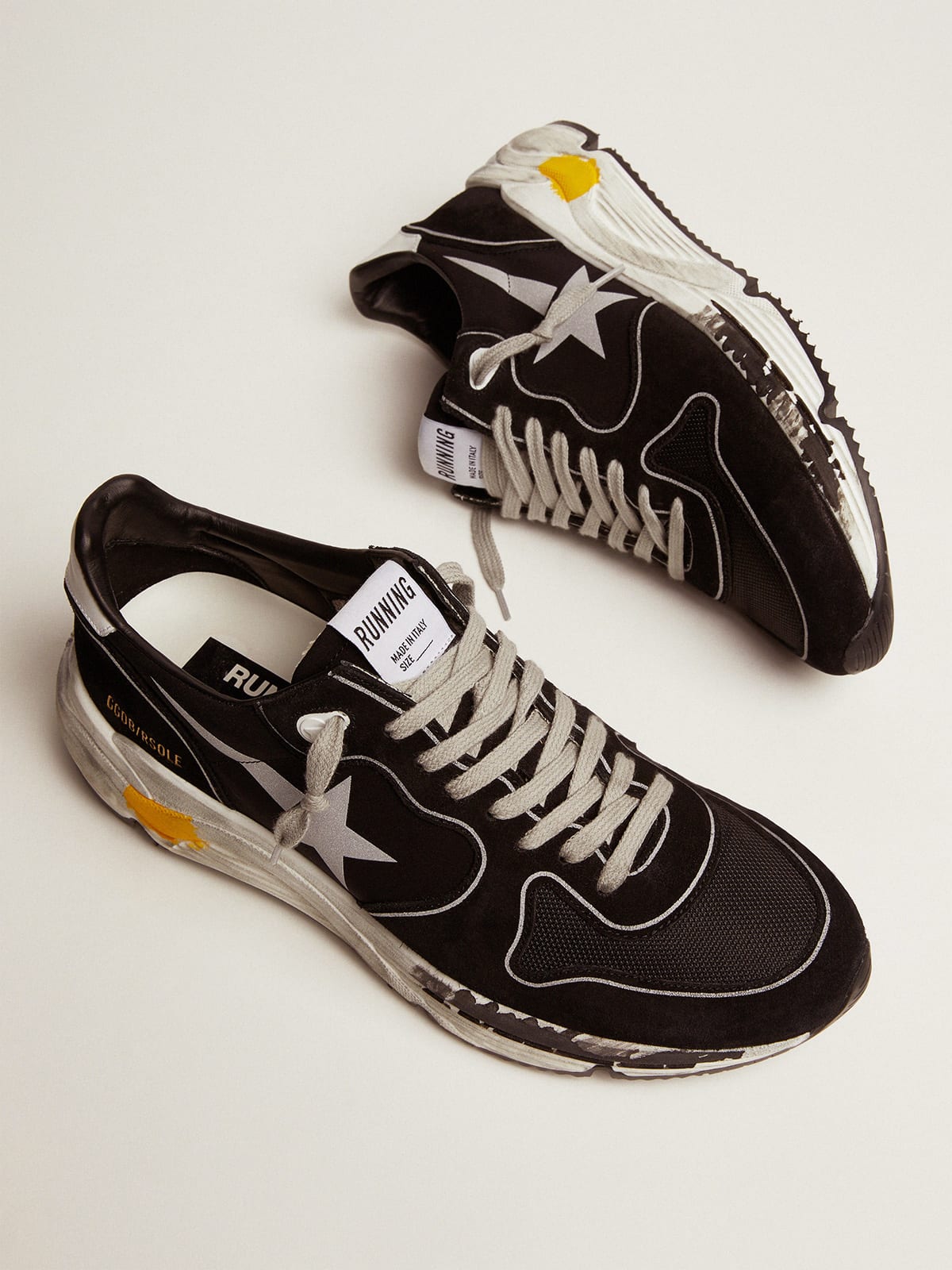 Men s black Running Sole sneakers with silver star Golden Goose