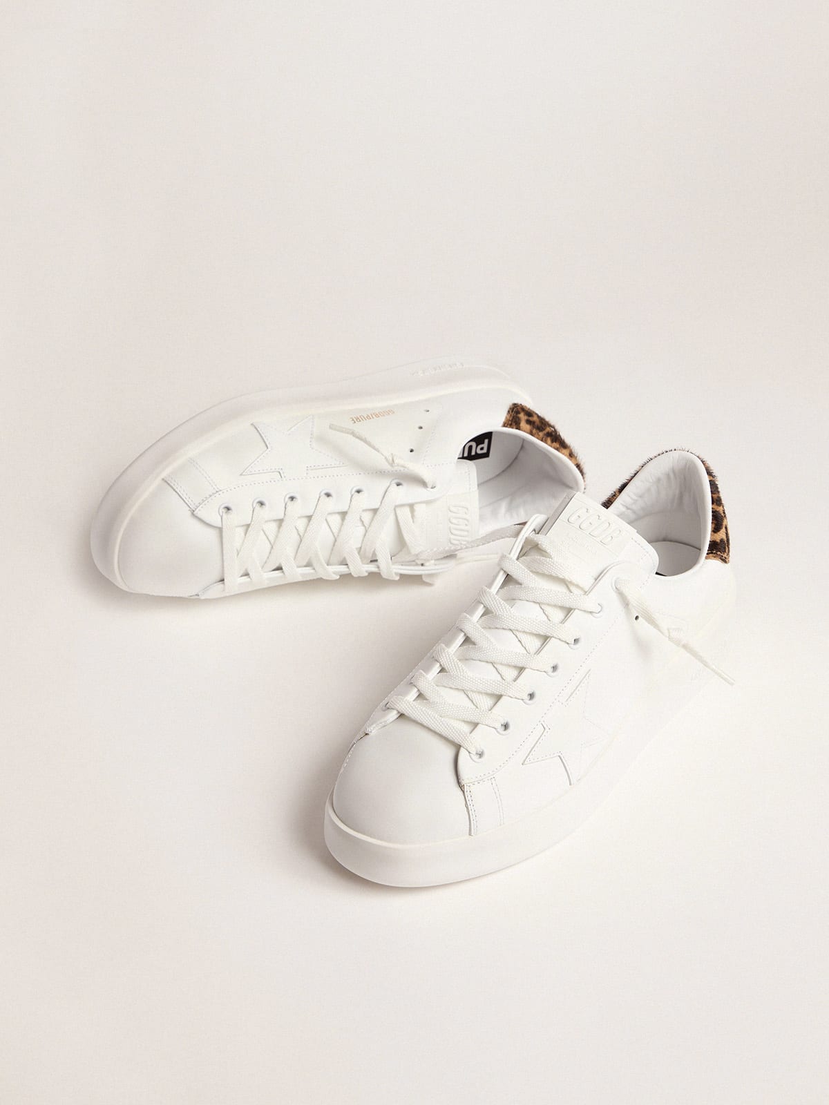 white sneakers with leopard back