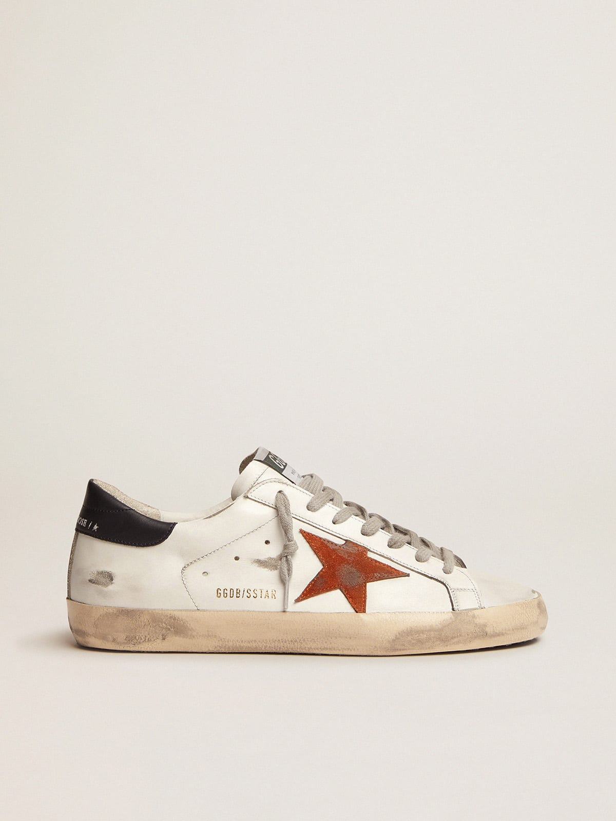 Young May with fluorescent orange leather star and perforated heel