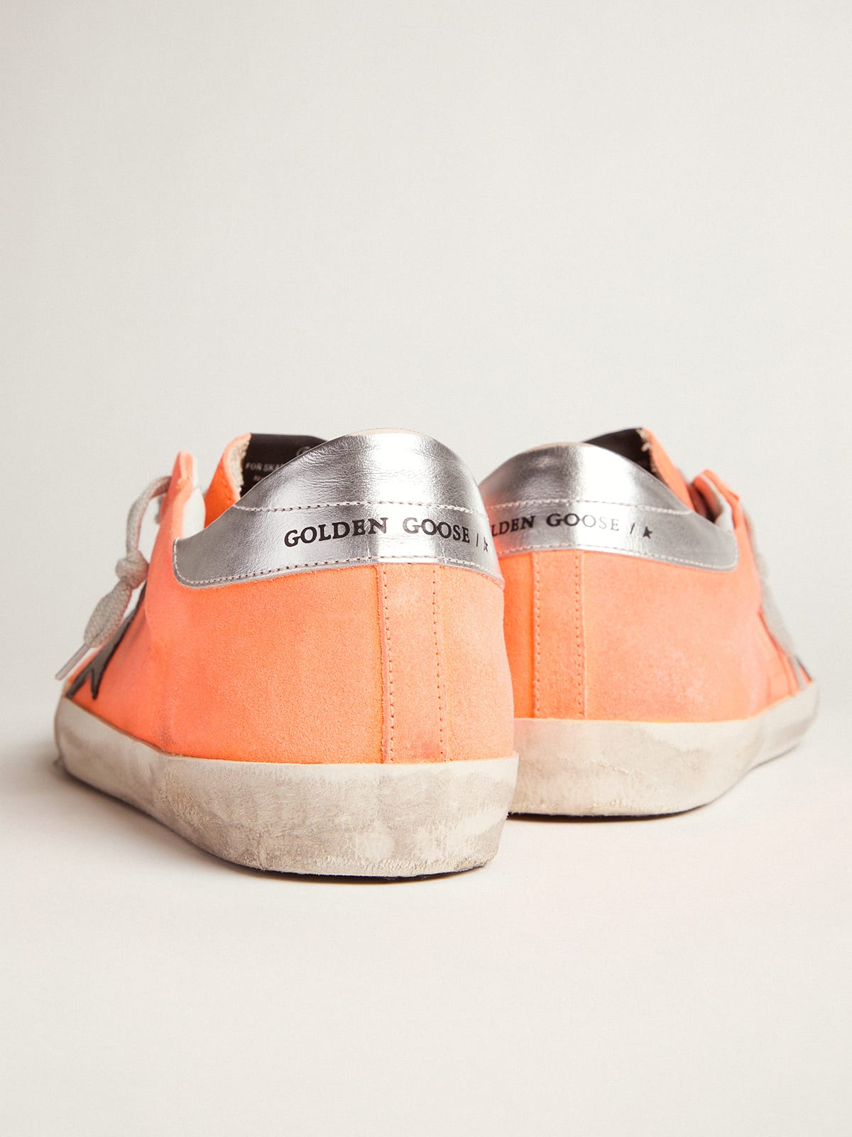 Orange golden goose store sneakers