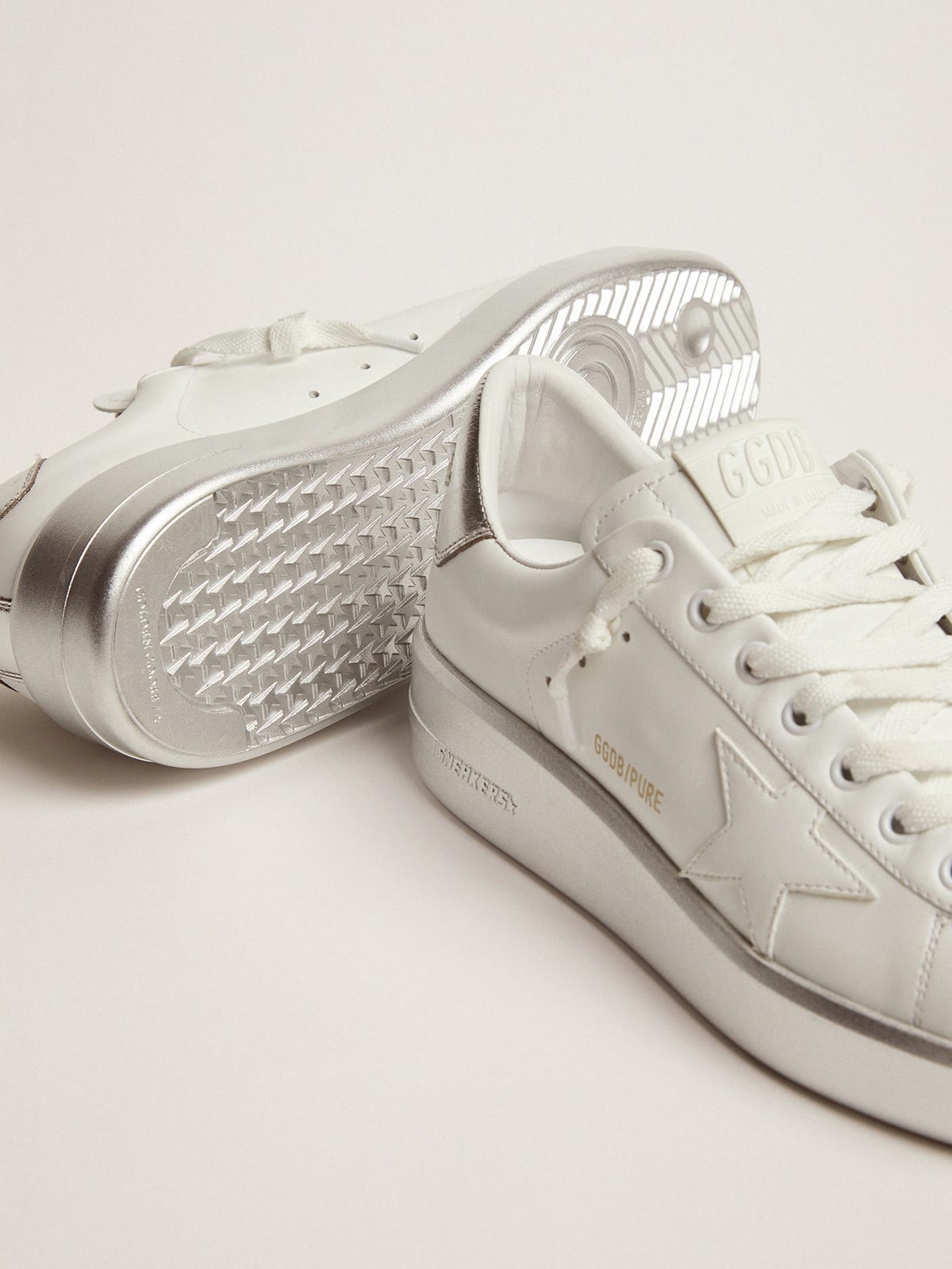 Purestar sneakers in leather with silver laminated heel tab and foxing |  Golden Goose