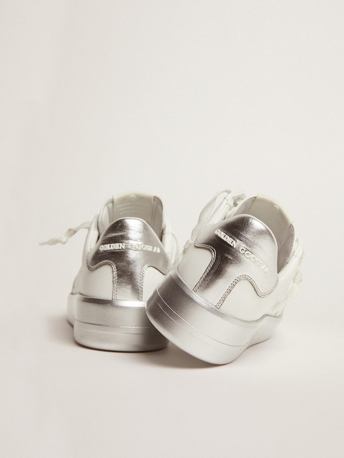 Purestar sneakers in leather with silver laminated heel tab and foxing |  Golden Goose