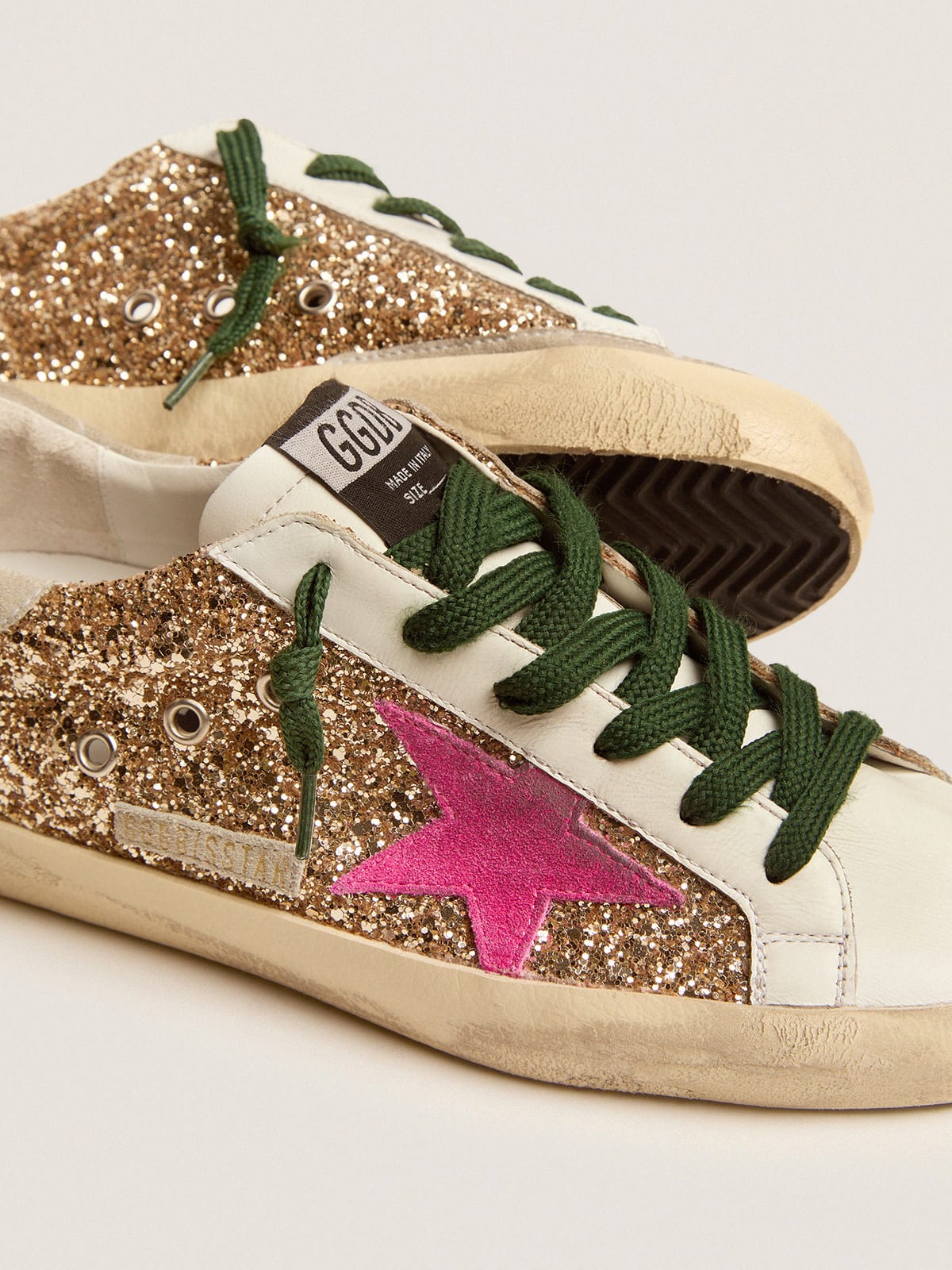 Super-Star sneakers in gold glitter with fluorescent pink suede star |  Golden Goose