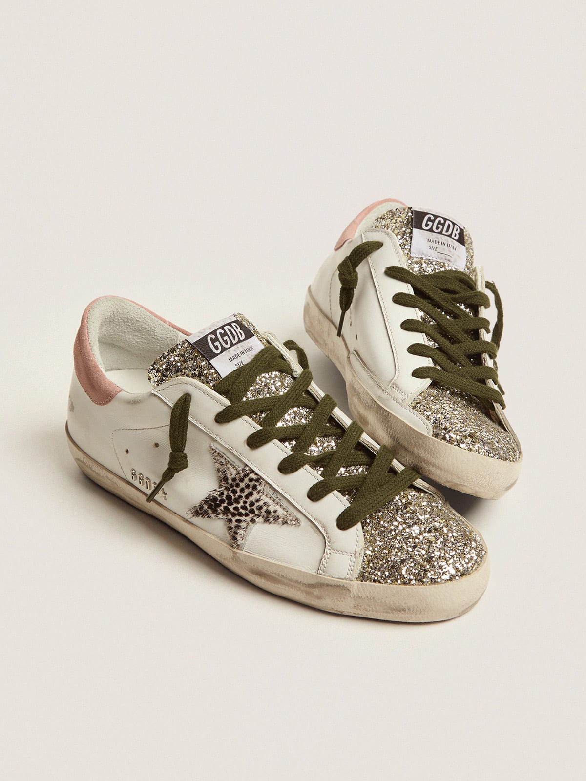 Super-Star LTD sneakers with silver glitter and animal-print pony skin star  | Golden Goose