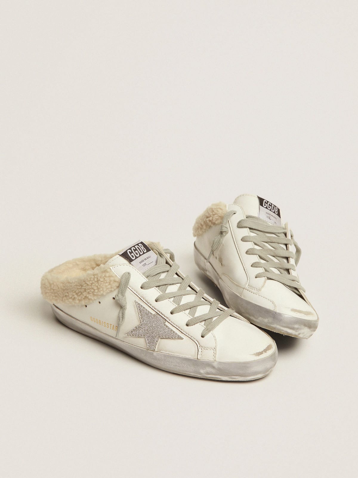 Super-Star Sabots in white leather with shearling lining