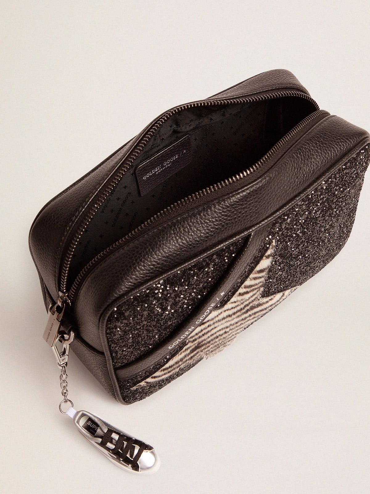 Golden Goose - Star Bag with black glitter and star in zebra-print pony skin in 