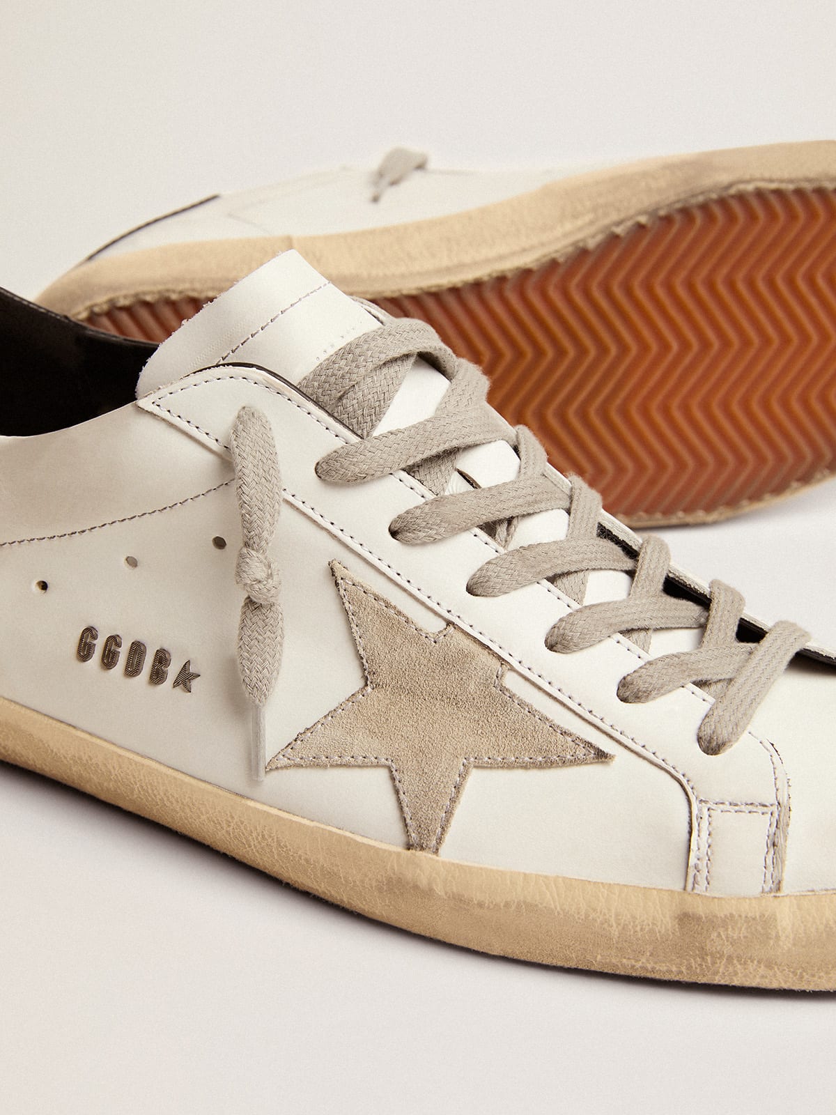 Men's Super-Star with black heel tab and metal stud lettering