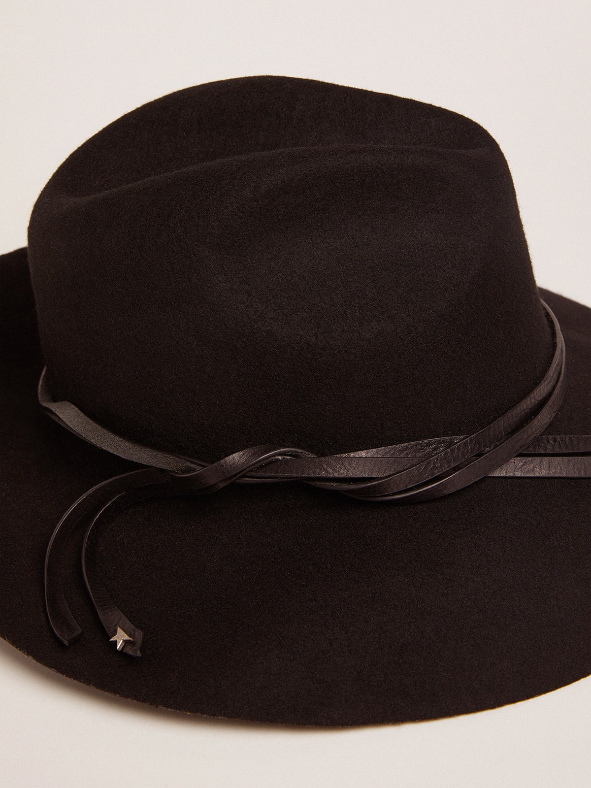 Black hat with leather strap