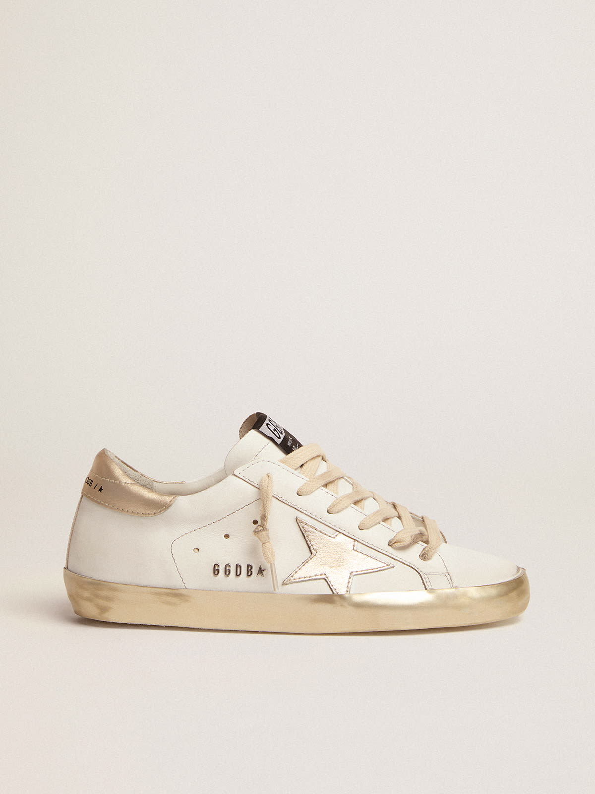 Women’s Super-Star sneakers with gold sparkle foxing and metal stud  lettering