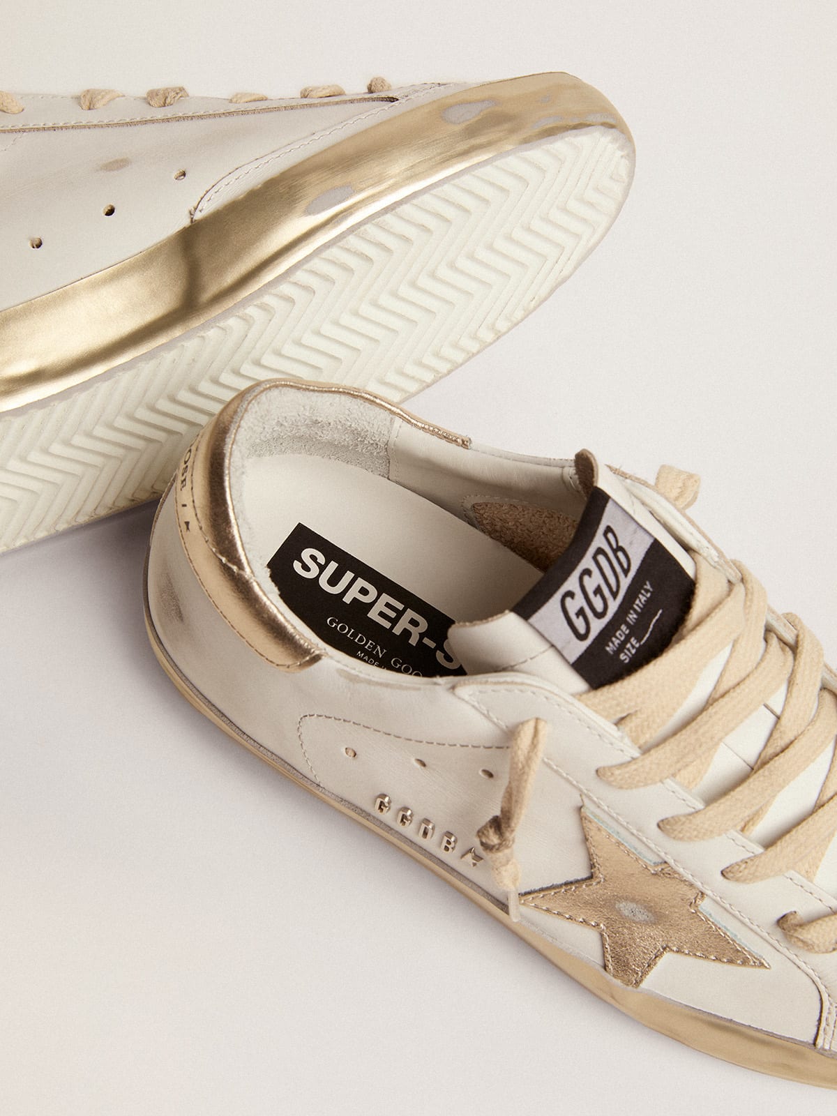 Golden Goose - Women’s Super-Star sneakers with gold sparkle foxing and metal stud lettering in 