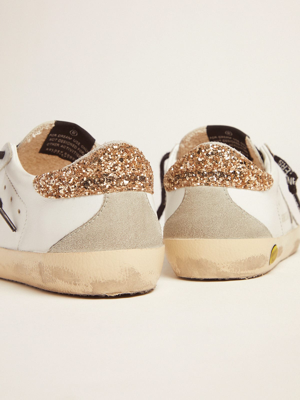 Young white leather Super-Star sneakers with glittery heel tab