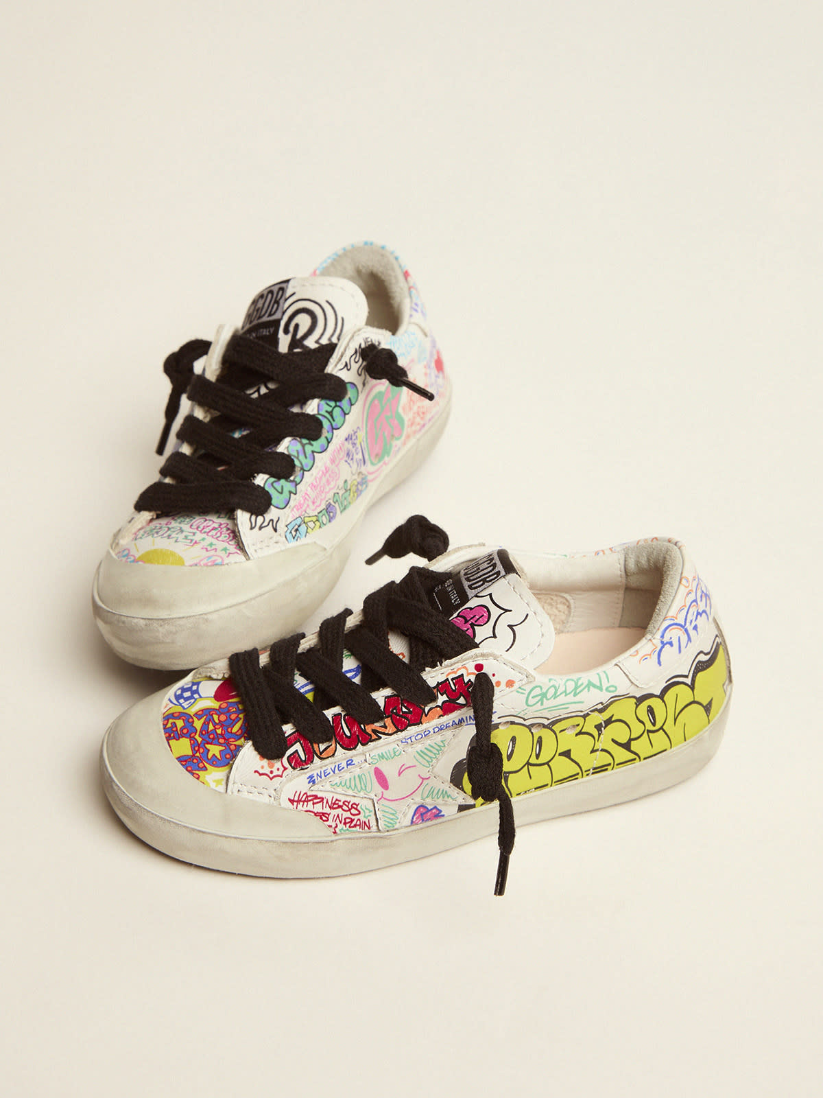 Young Super-Star sneakers in white leather with multicolored graffiti print  | Golden Goose