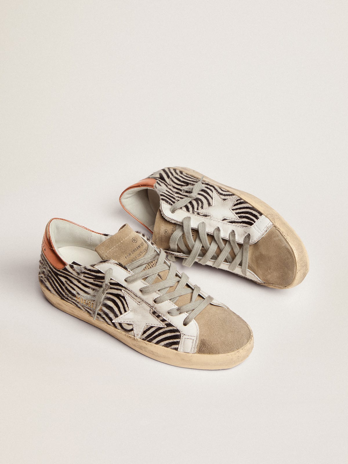 Golden Goose - Super-Star LTD sneakers in zebra-print pony skin with white leather star and orange laminated leather heel tab in 