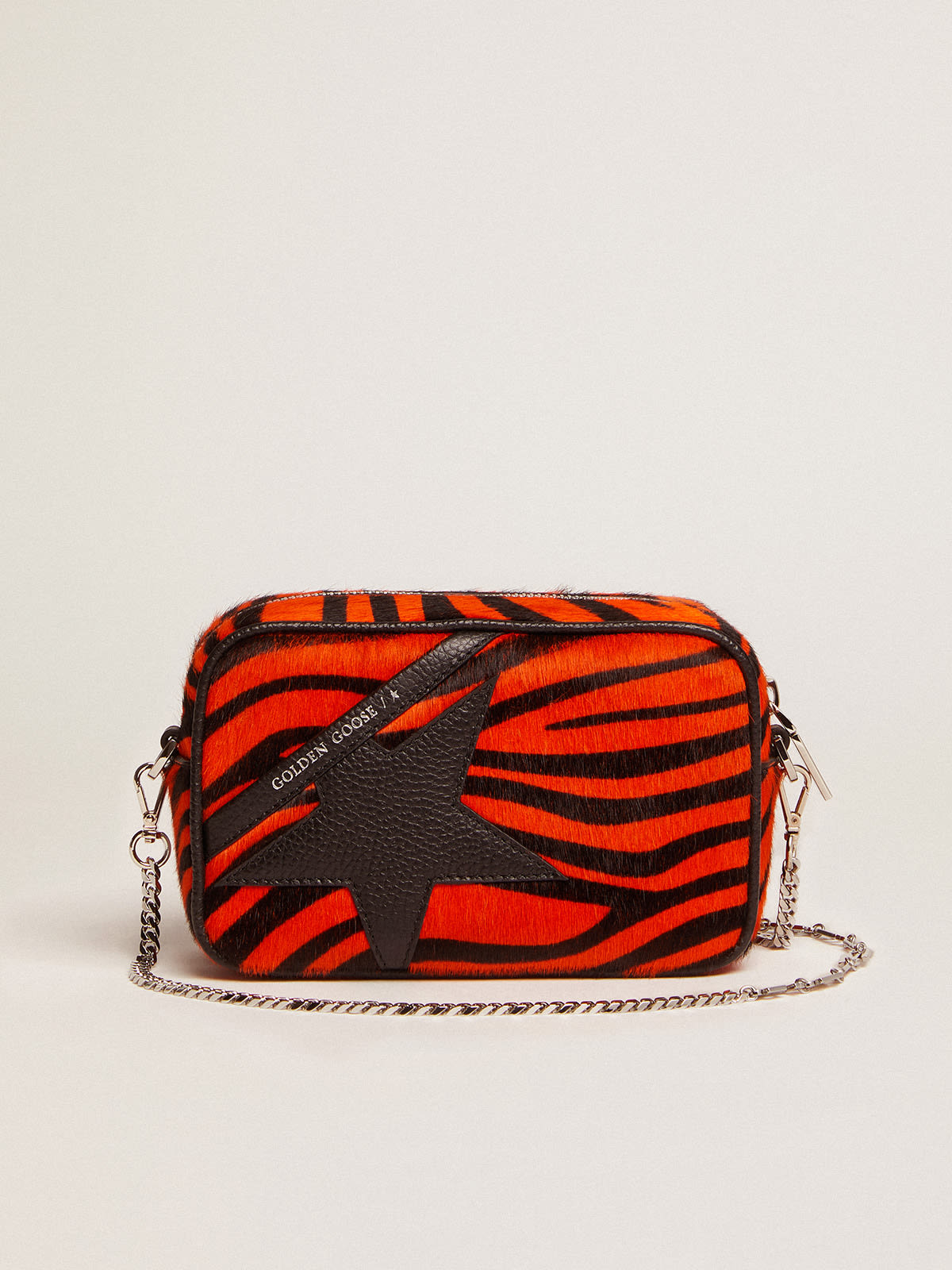 Golden Goose - Bolso Mini Star Bag de piel efecto potro con estampado tigre en color naranja y estrella de piel negra in 