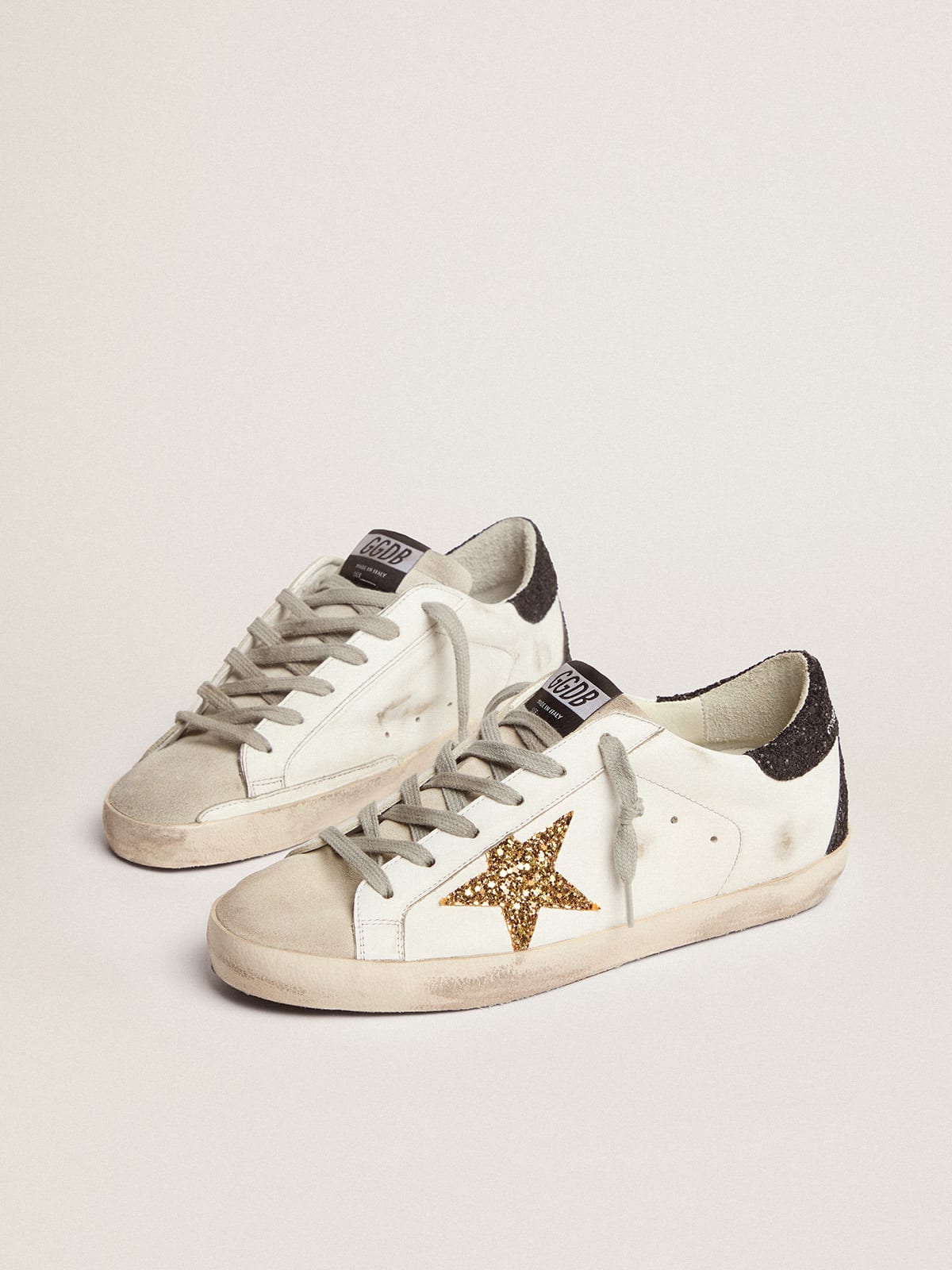 Golden Goose - Women's Super-Star with gold star and black glitter heel tab in 