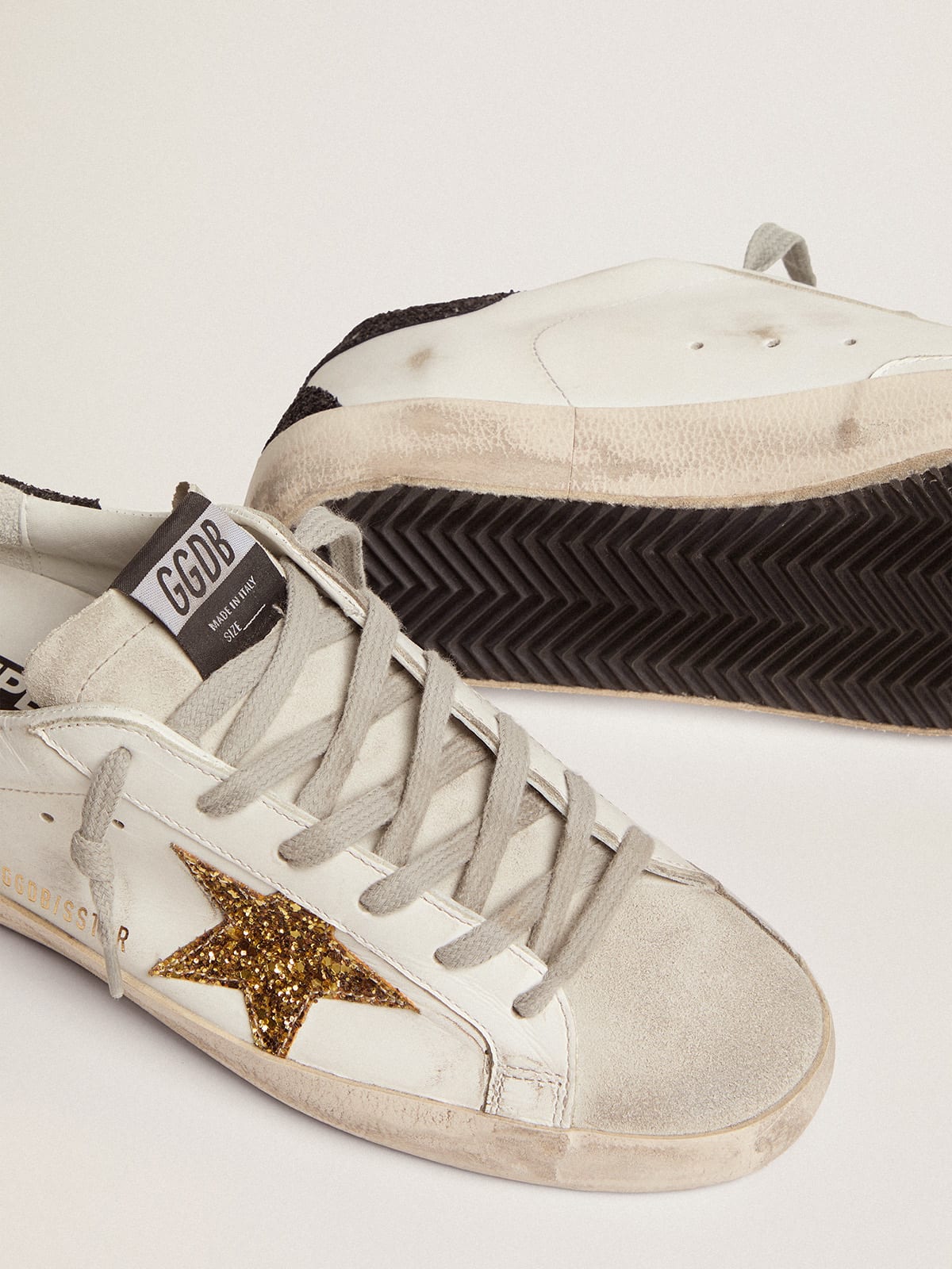 Super-Star sneakers with gold star and glittery black heel tab 