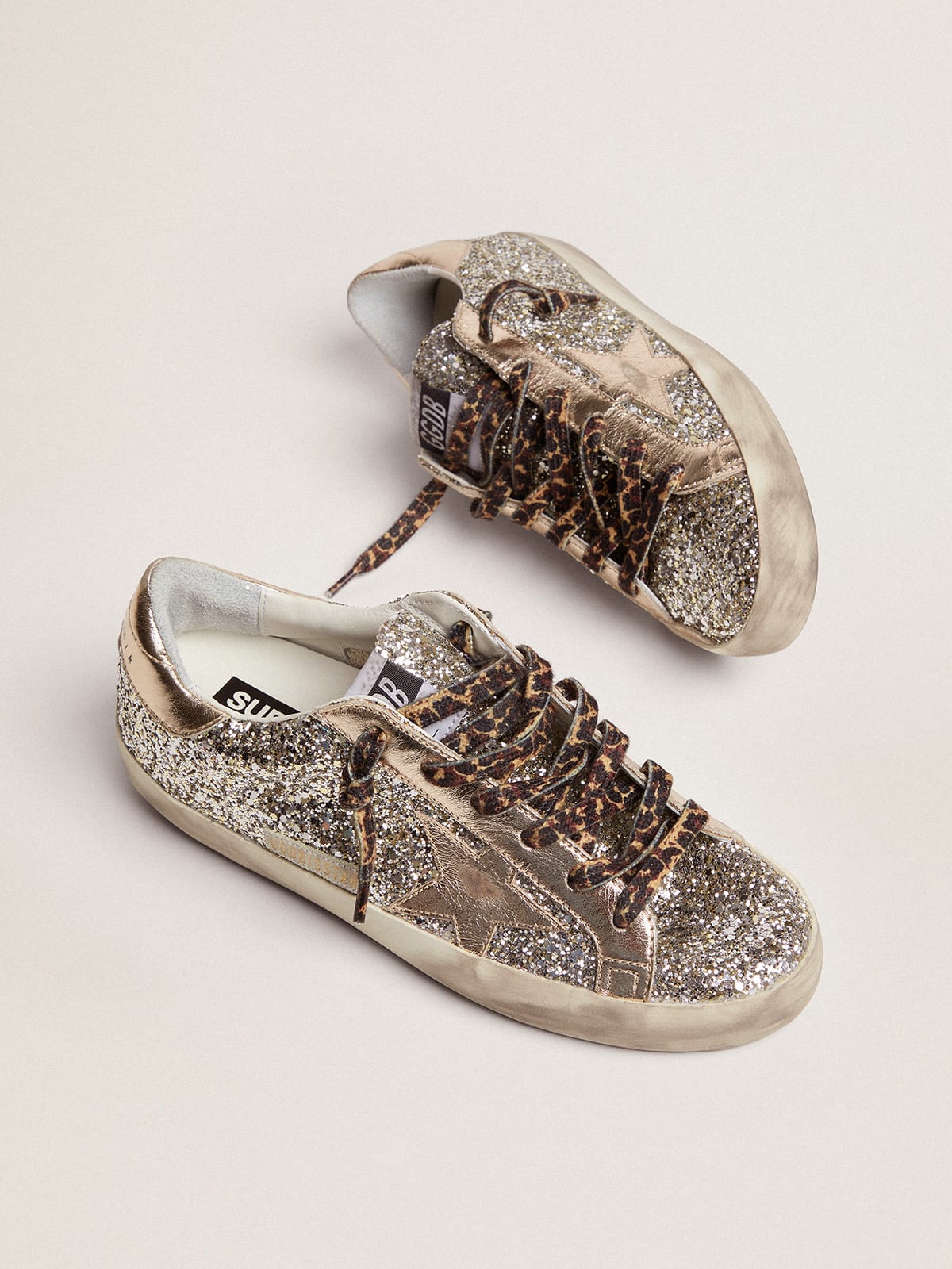 Golden Goose - Super-Star sneakers in platinum-colored glitter with star and heel tab in tone-on-tone laminated leather in 