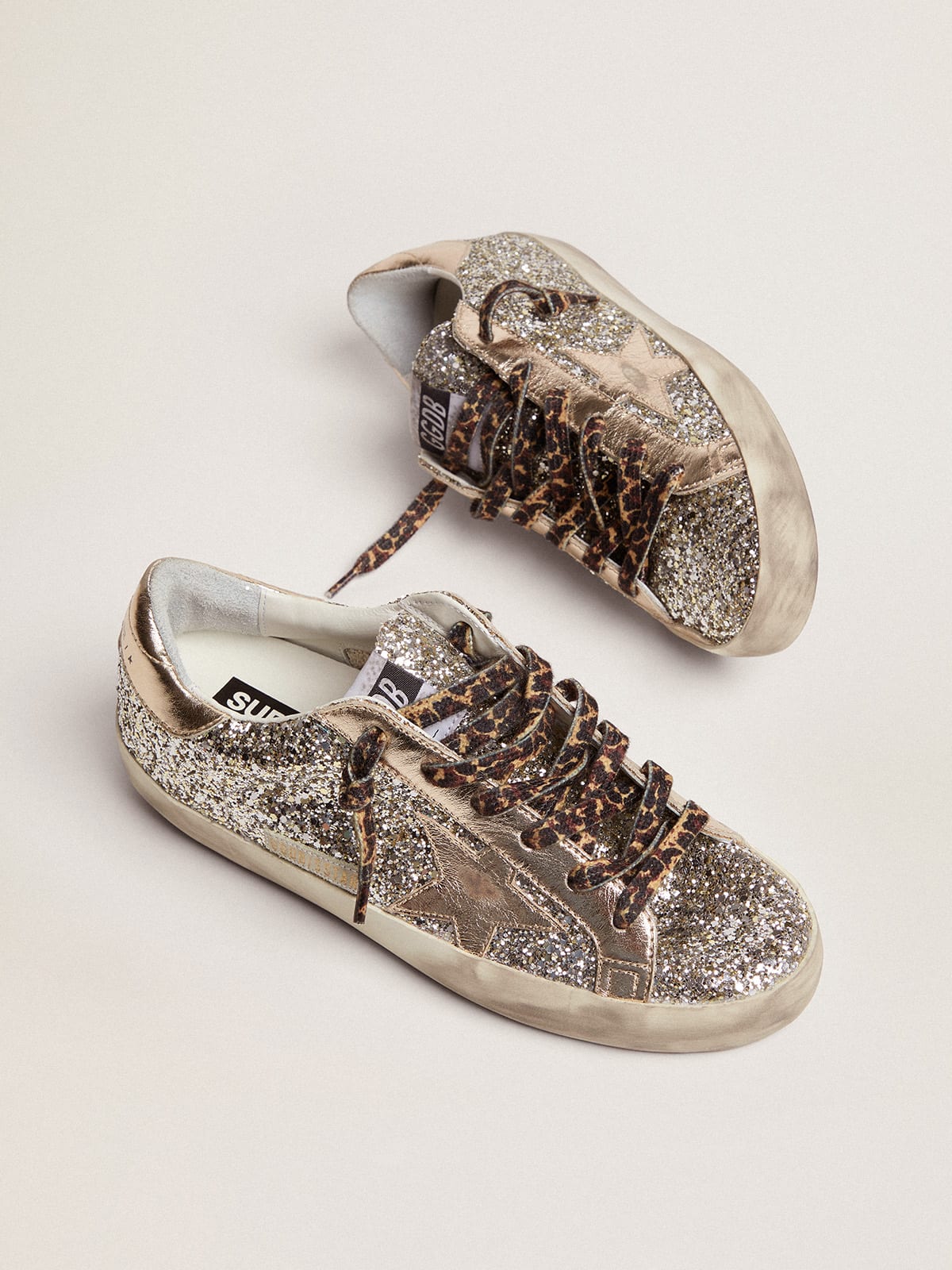 Women\'s Super-Star in platinum glitter with leather star and heel tab |  Golden Goose