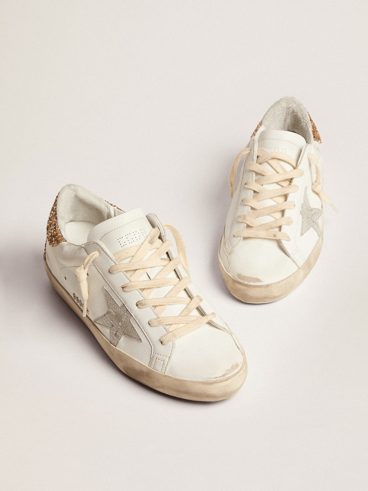 Golden Goose - Super-Star sneakers with snake-print silver leather star and gold glitter heel tab in 