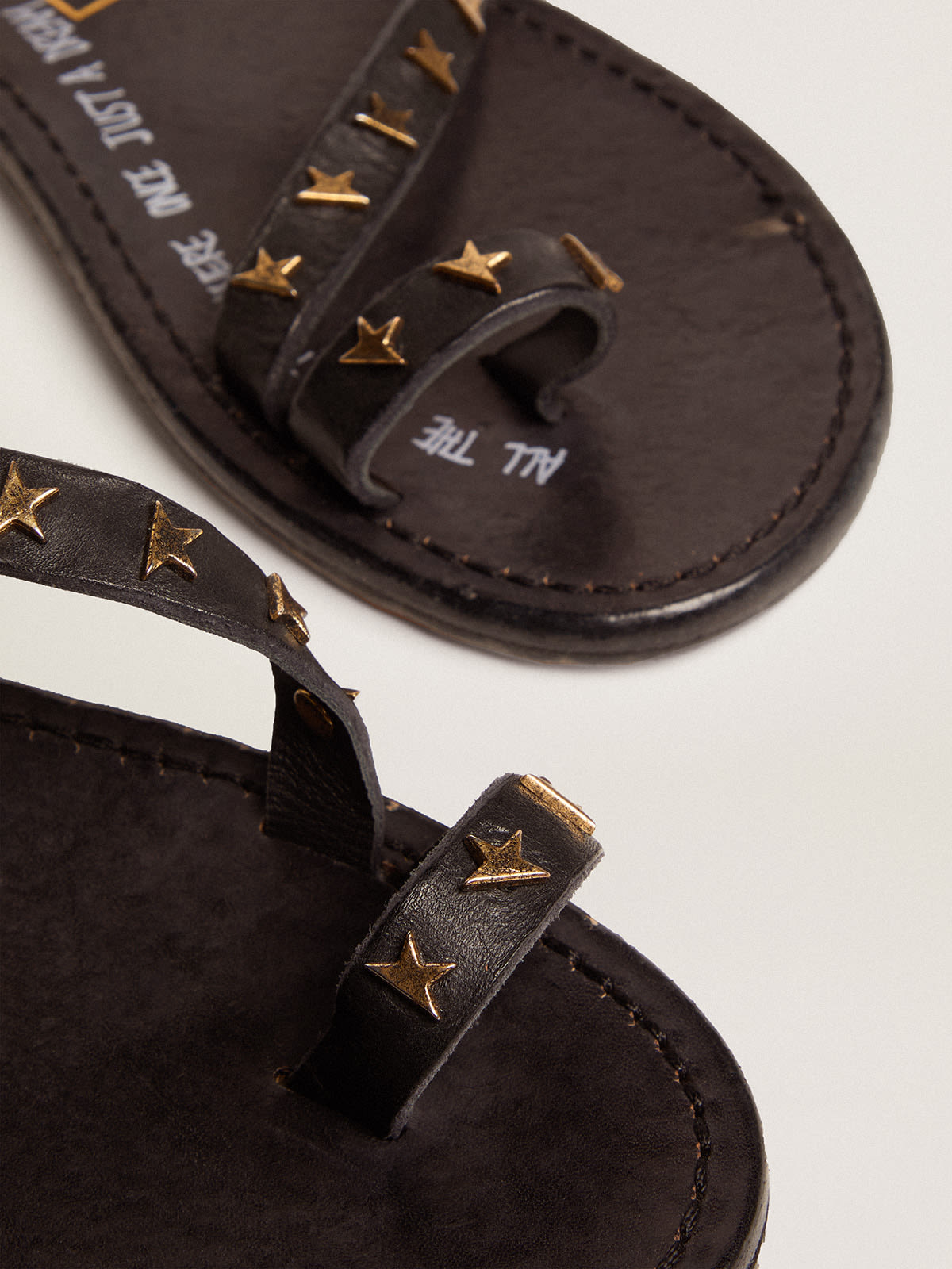 Golden Goose - Women's flat sandals in black leather with gold stars in 