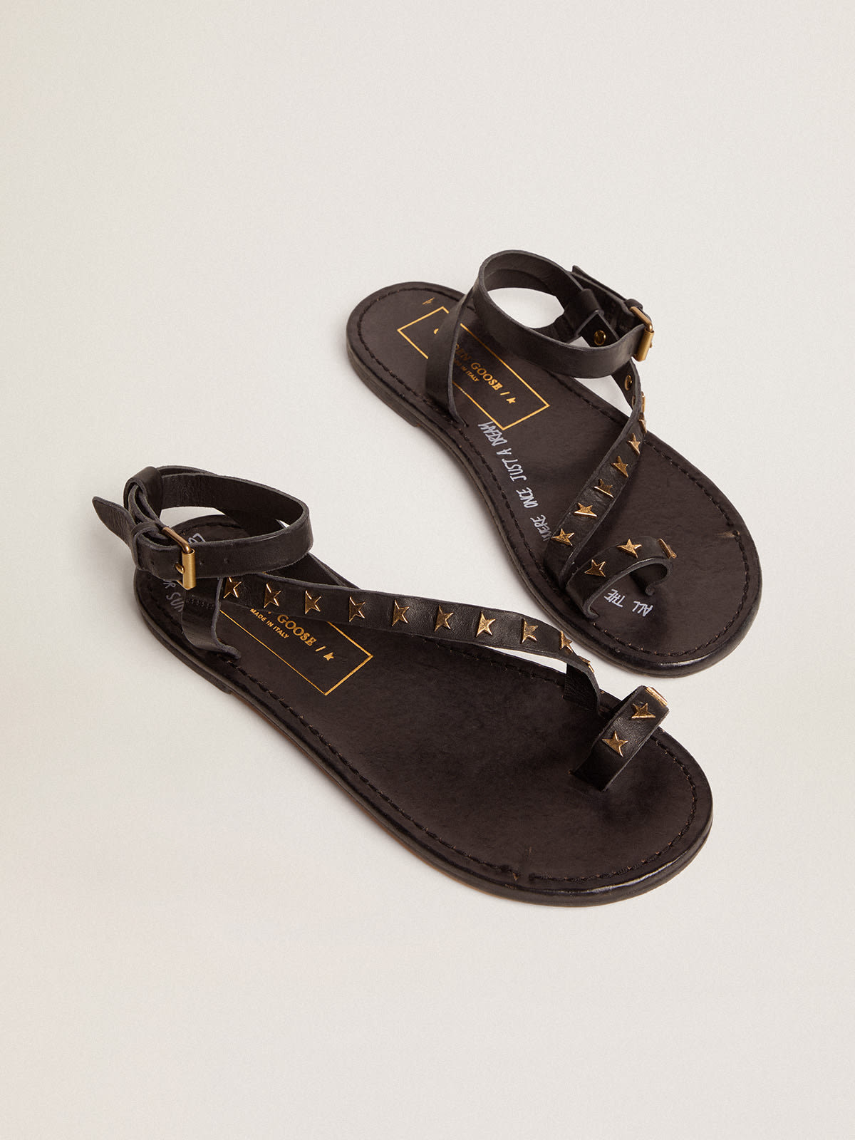 Golden Goose - Women's flat sandals in black leather with gold stars in 