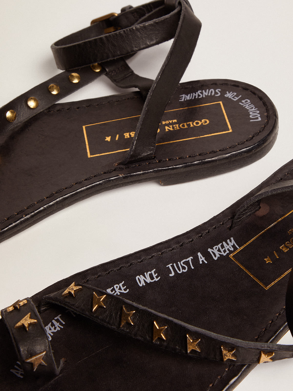 Golden Goose - Women's flat sandals in black leather with gold stars in 