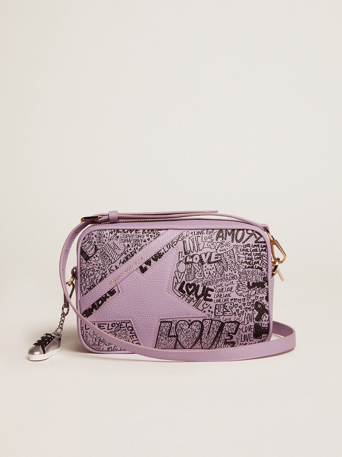 Lilac hammered leather Star Bag with tone-on-tone leather star and black  all-over graffiti print