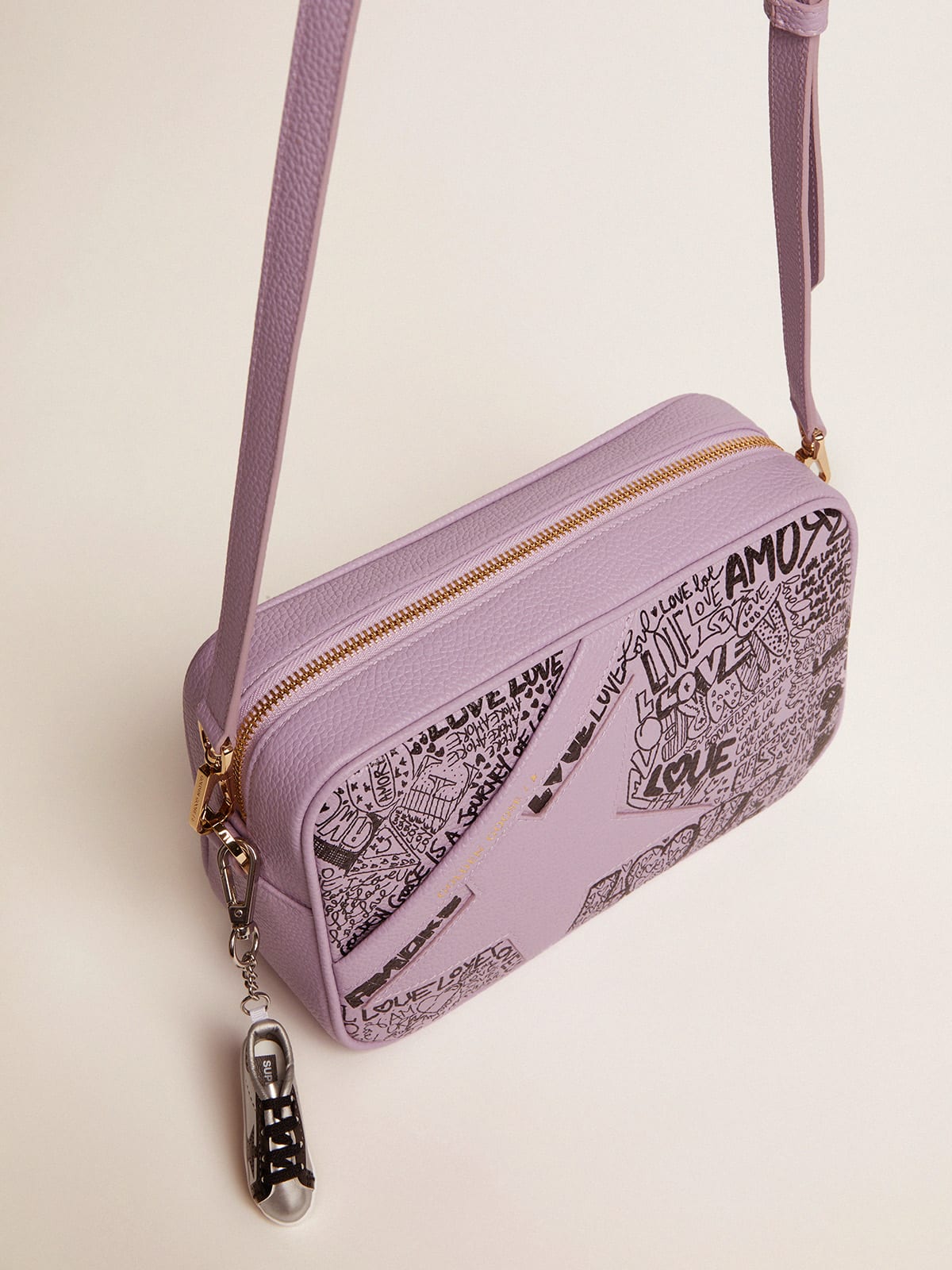 Lilac hammered leather Star Bag with tone-on-tone leather star and black  all-over graffiti print