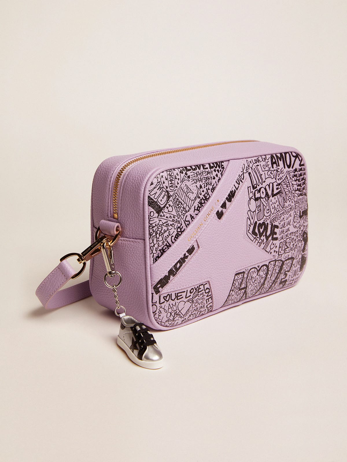 Lilac hammered leather Star Bag with tone-on-tone leather star and black  all-over graffiti print