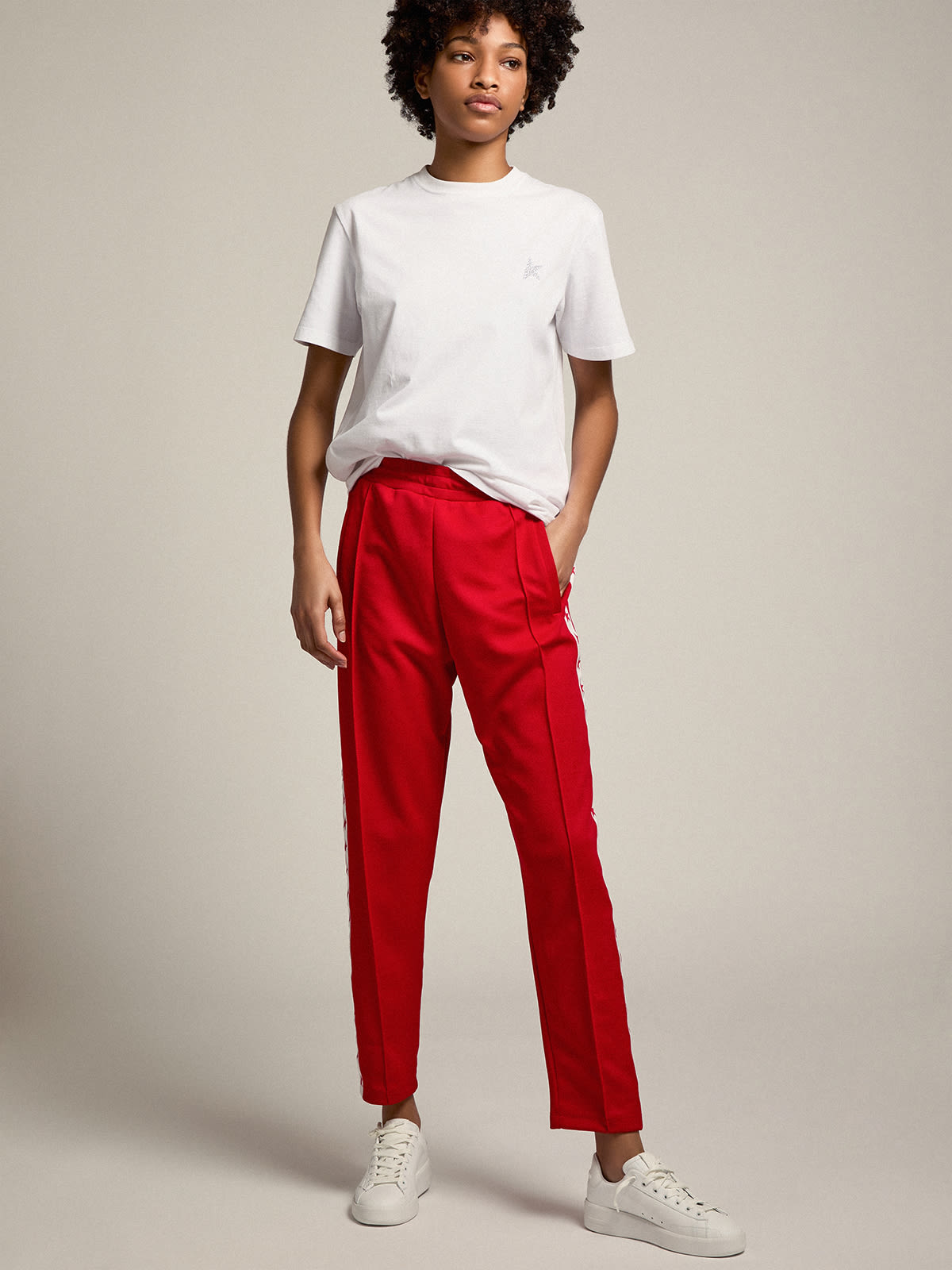 Women's red sweatpants with stars on the side