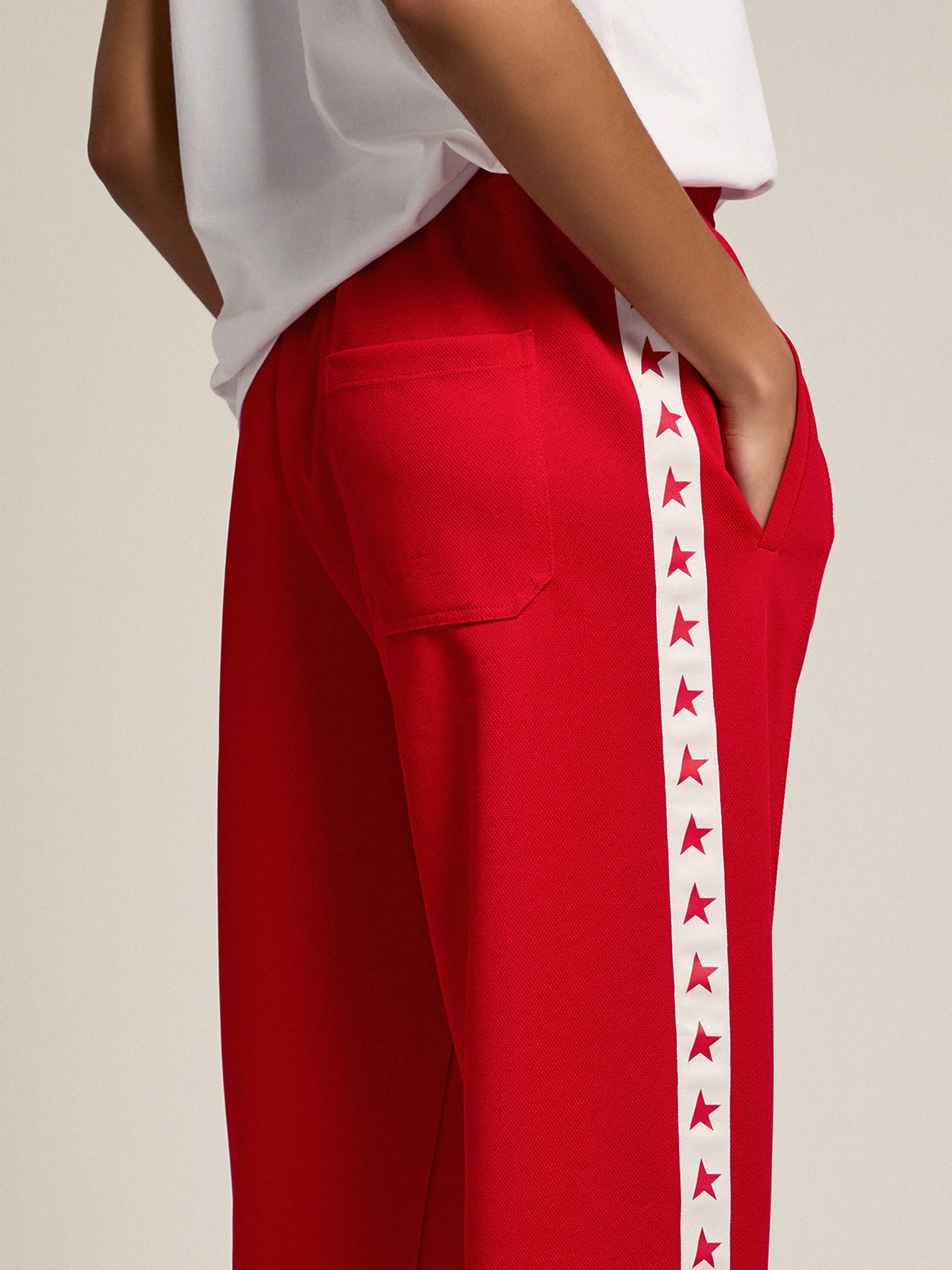 Women's red joggers with stars on the sides