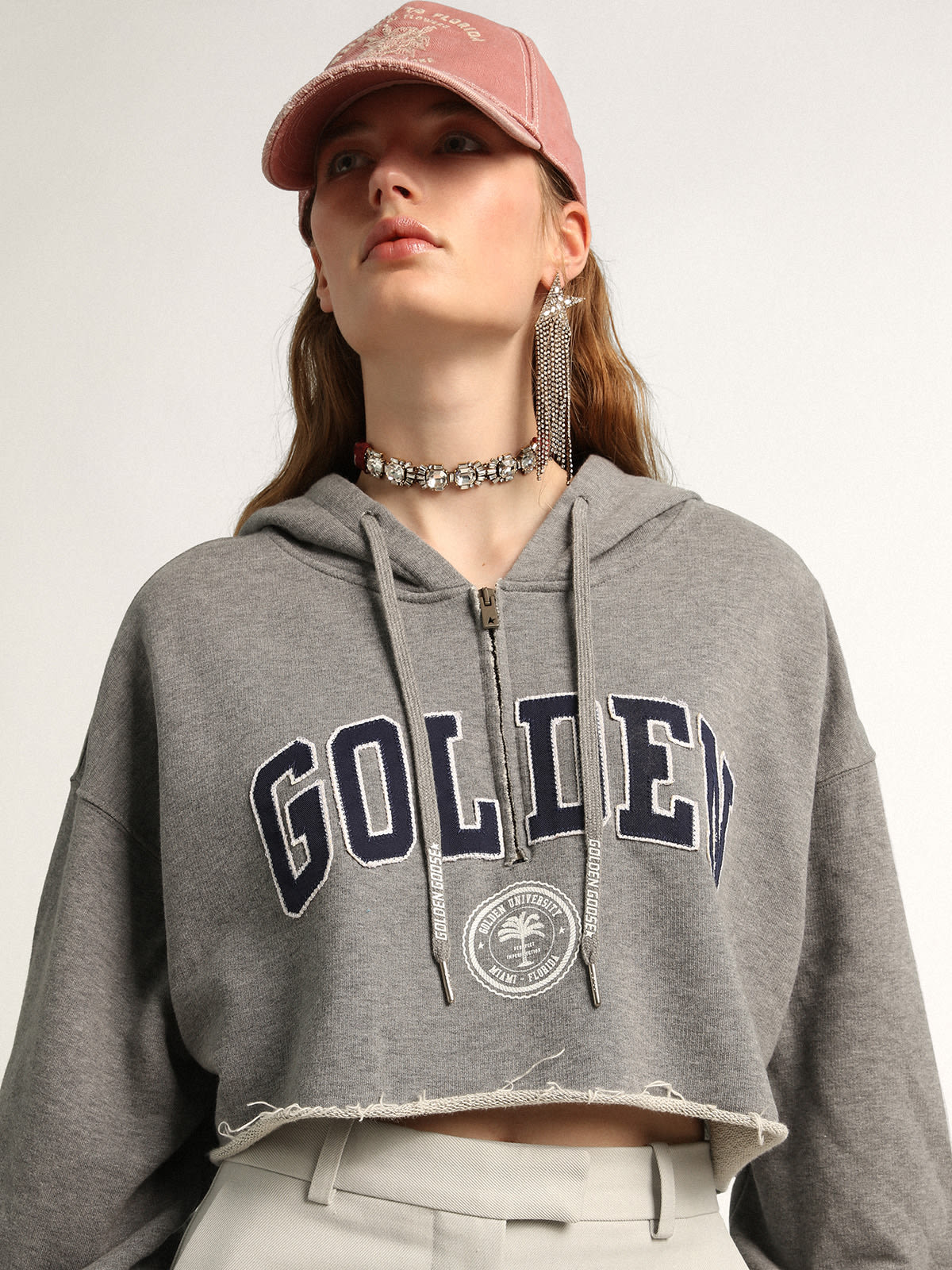 Cropped Journey Collection hooded sweatshirt in gray with dark blue Golden lettering