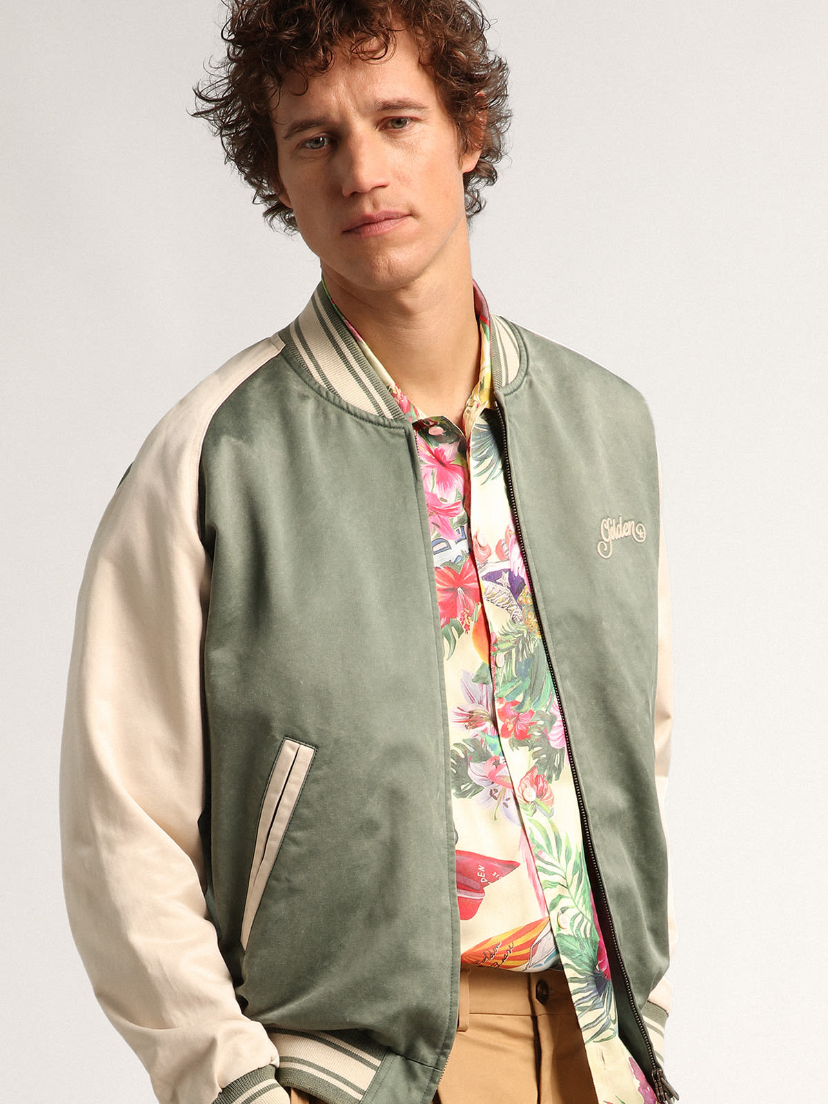 Military-green and white Journey Collection Eric bomber jacket with a  lived-in effect and contrasting embroidery on the back