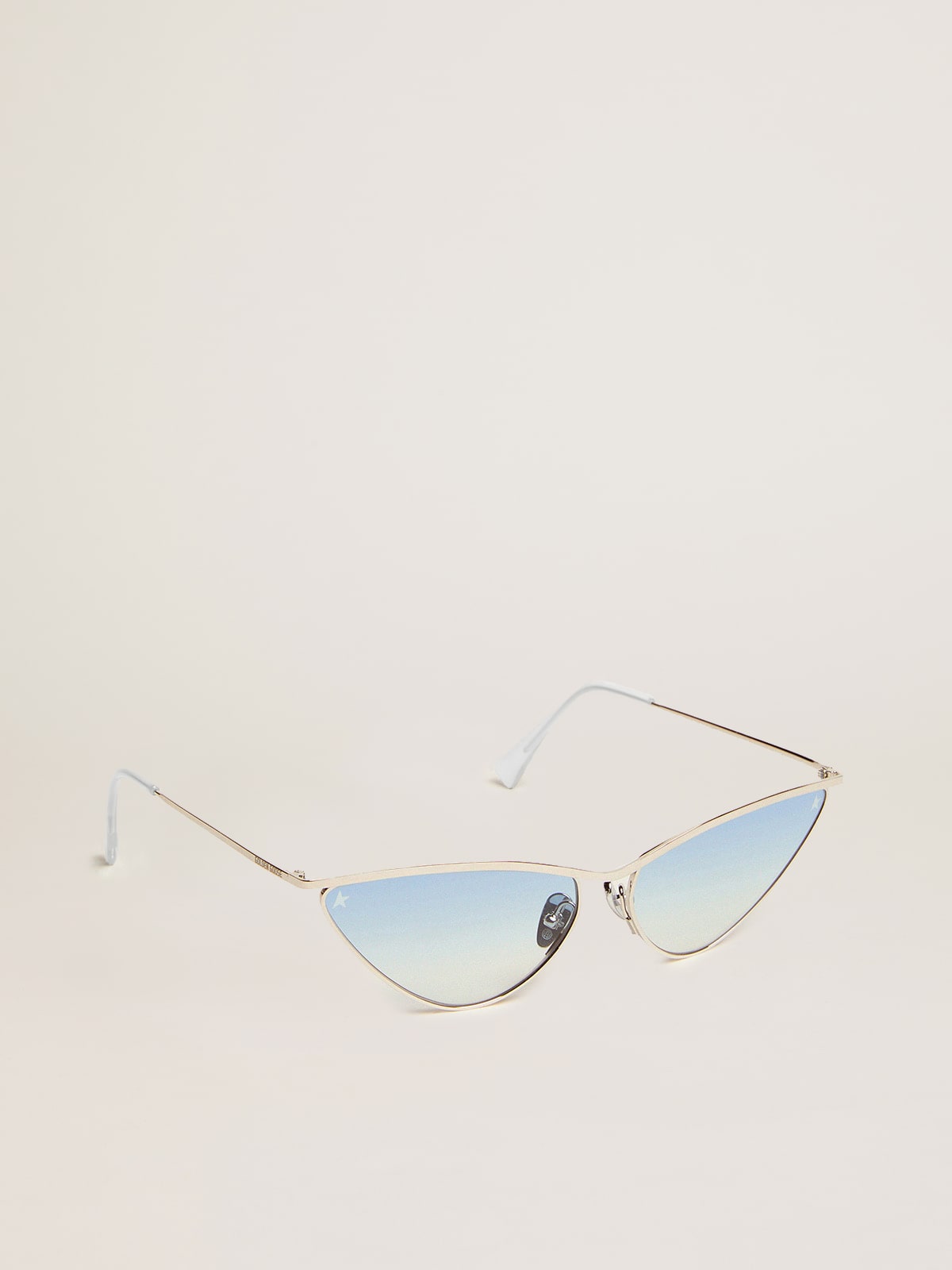 Sunglasses cat-eye style with silver frame and blue lenses