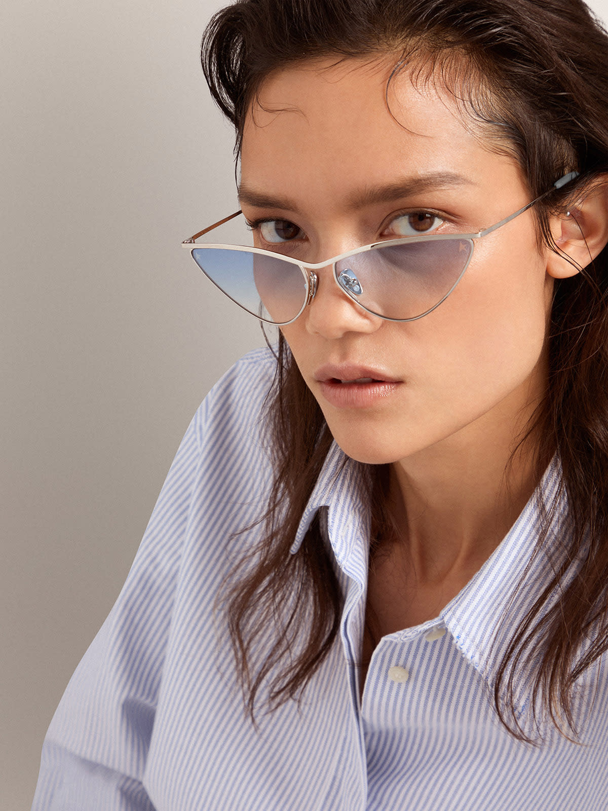 Sunglasses cateye style with silver frame and blue lenses Golden Goose