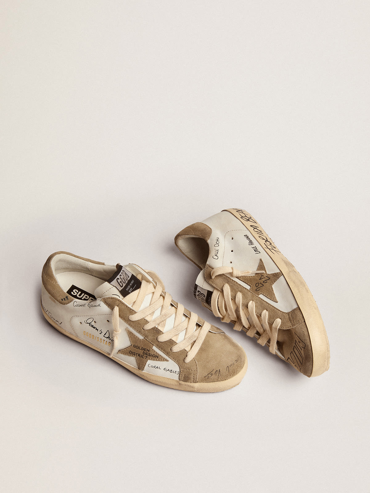 Golden Goose - Super-Star sneakers in white leather with dove-gray suede inserts and all-over black lettering in 