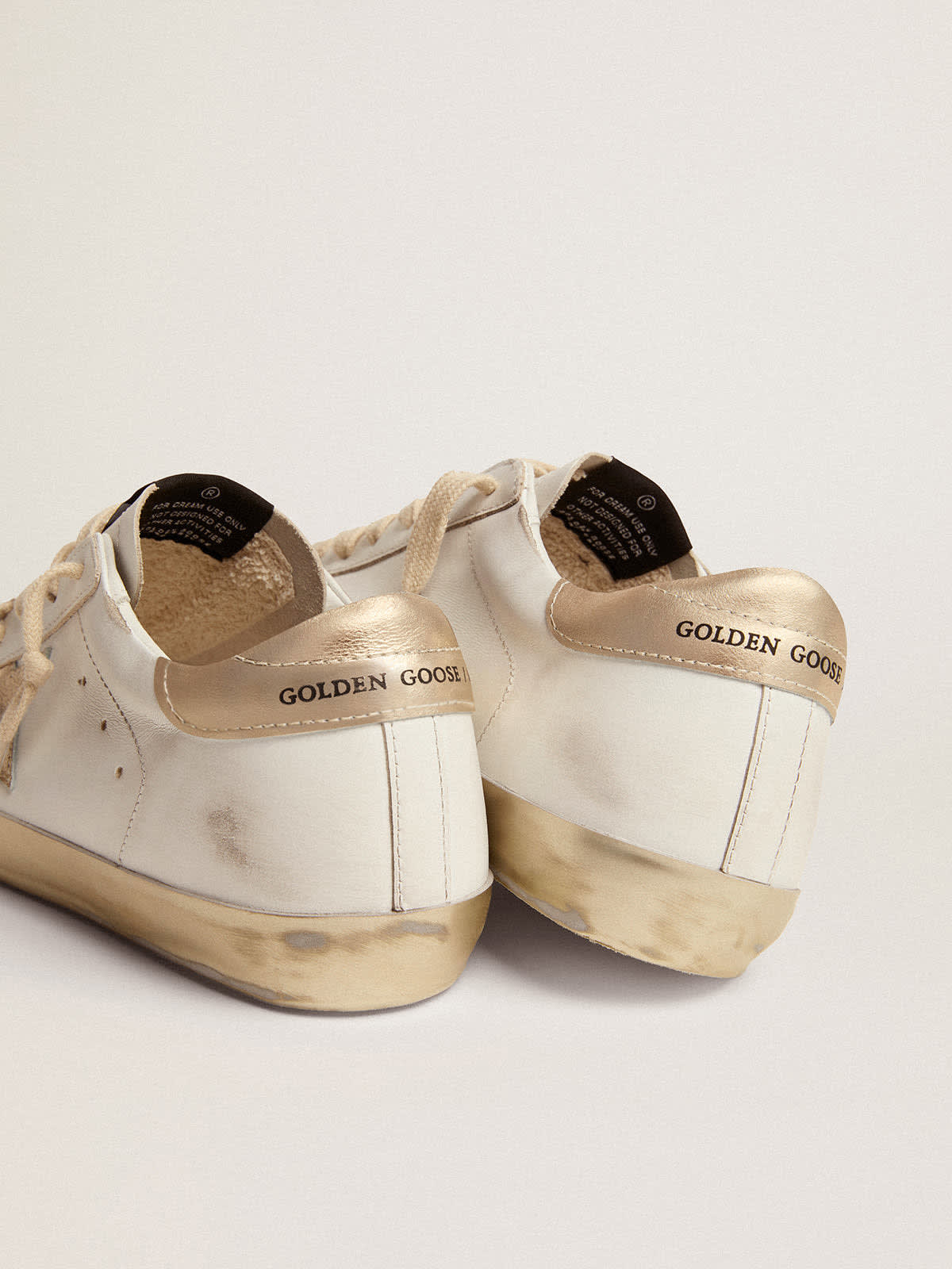 Golden Goose - Women’s Super-Star sneakers with gold sparkle foxing and metal stud lettering in 