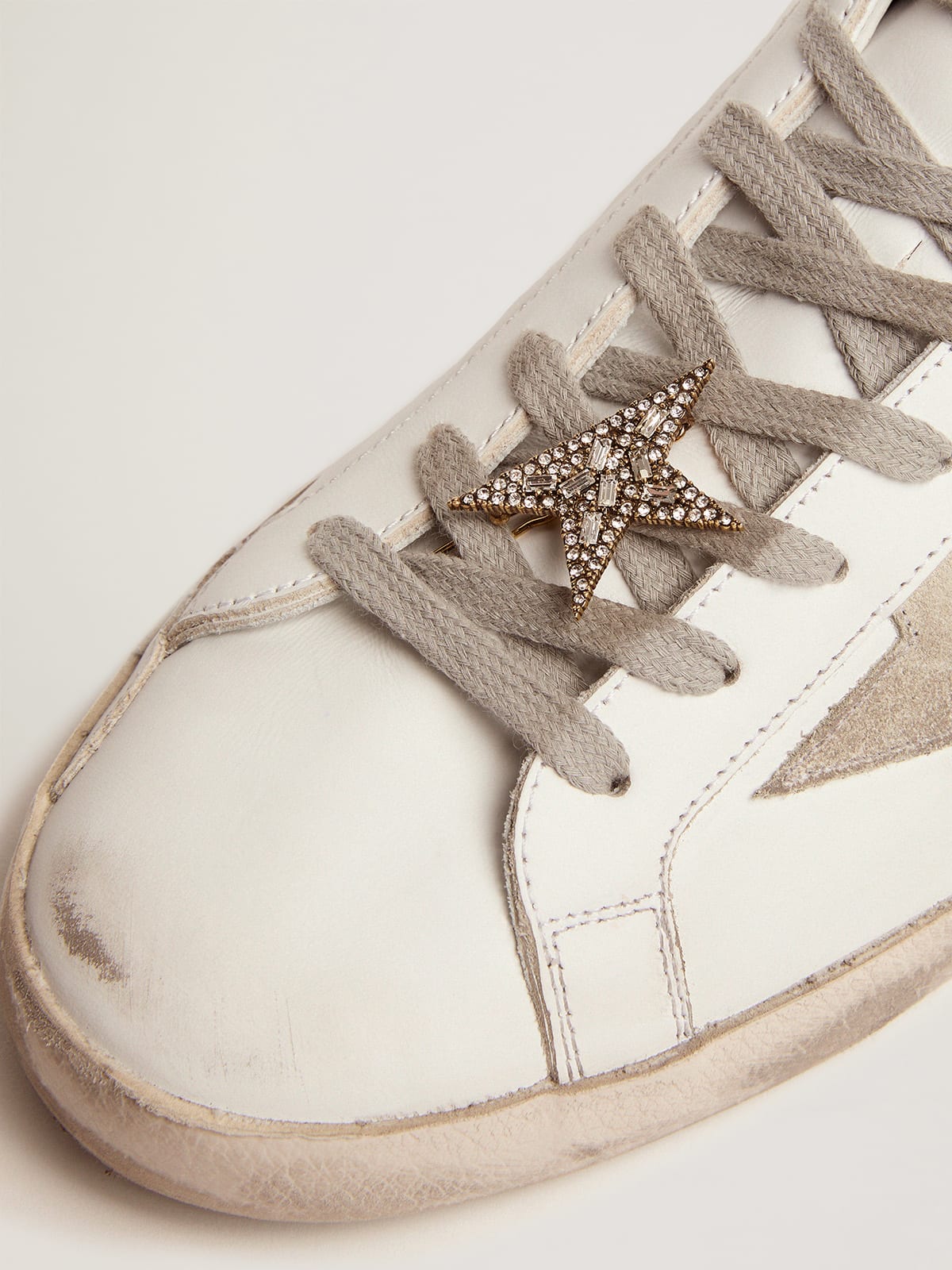 Golden Goose - Star-shaped lace lock in old gold color with decorative crystals in 