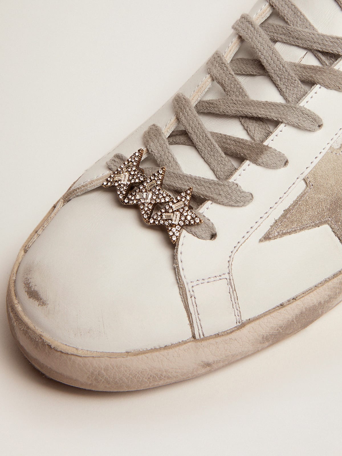 Golden Goose - Lace accessory with three old gold color stars with crystals in 