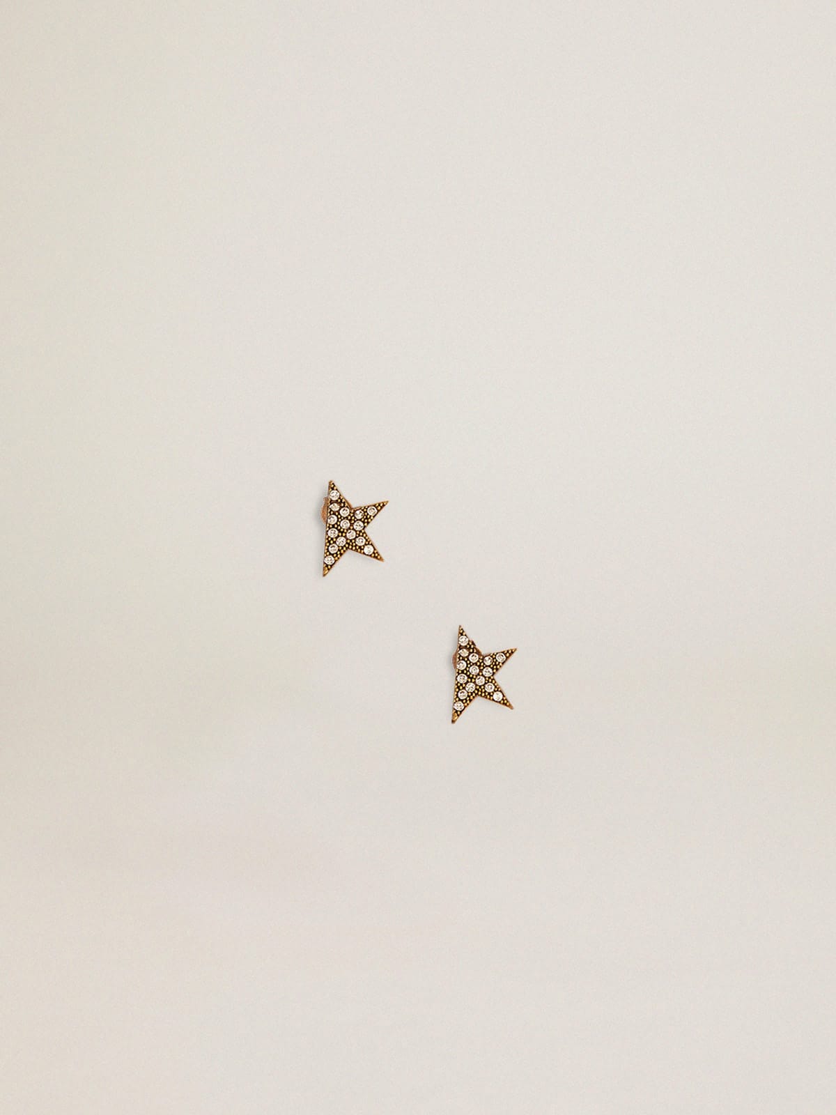 Golden Goose - Stud earrings in old gold color with decorative crystals in 