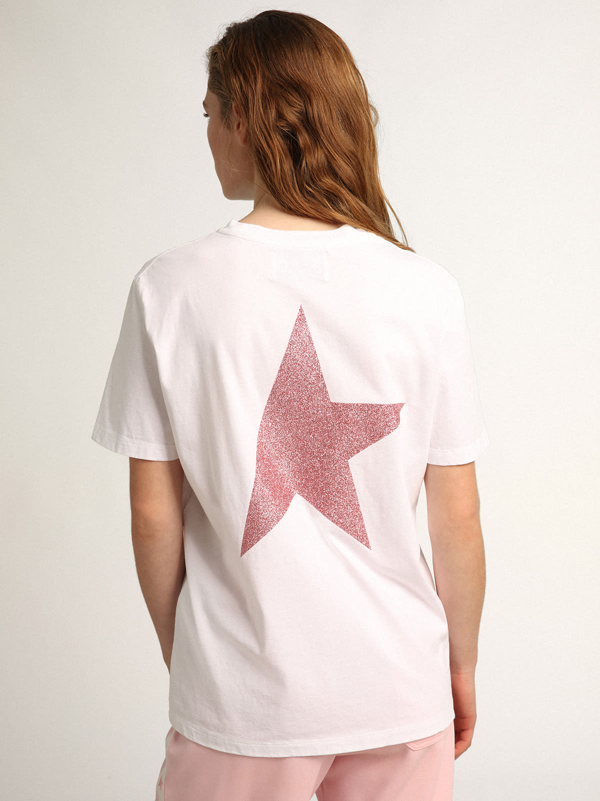 Women's white T-shirt with pink glitter logo and star