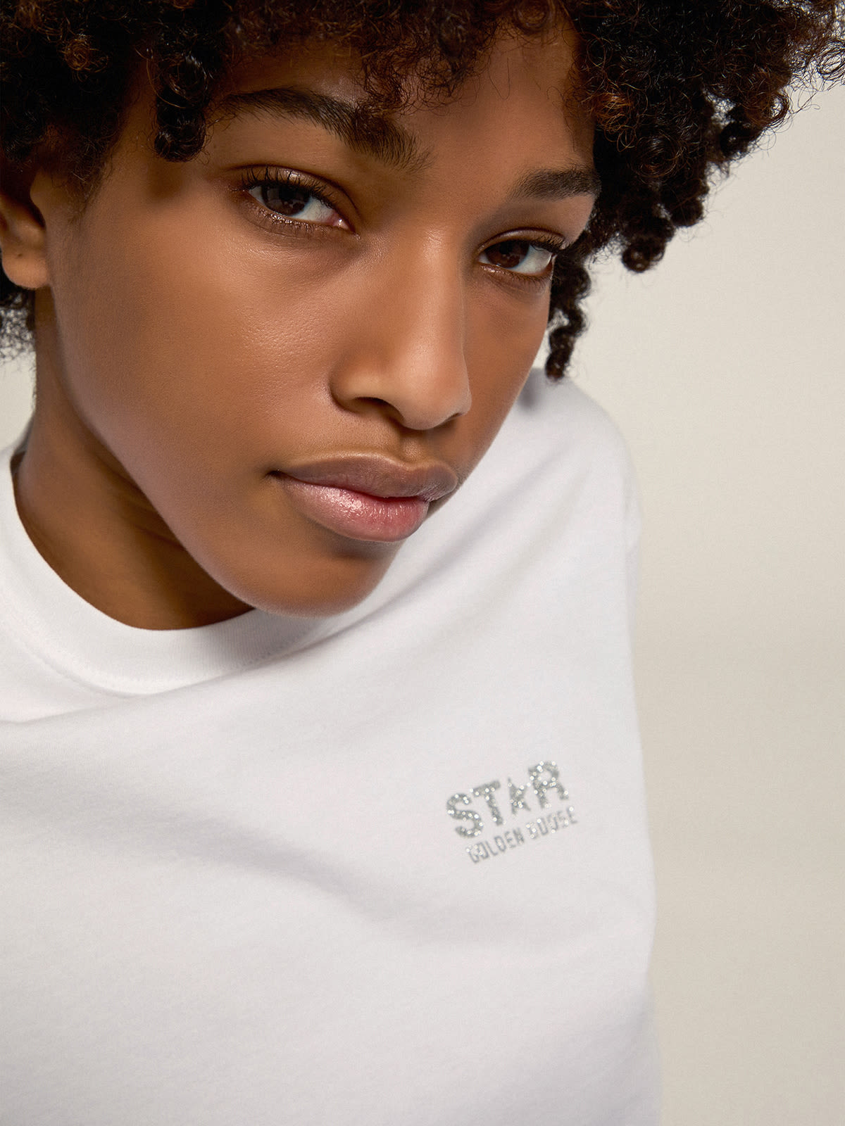 Women s white T shirt with silver glitter logo and star