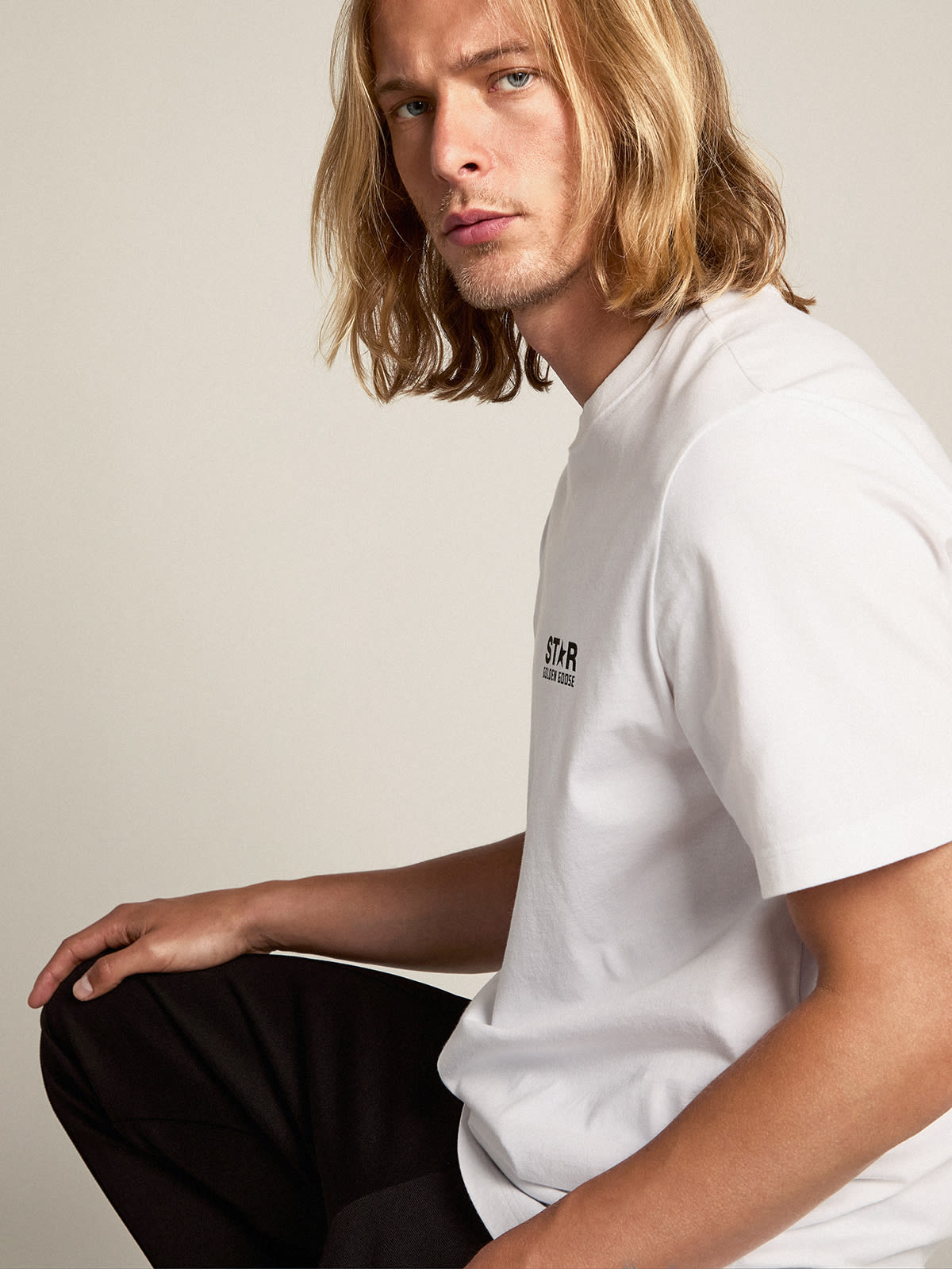 Pale pink men's T-shirt with lettering in the center