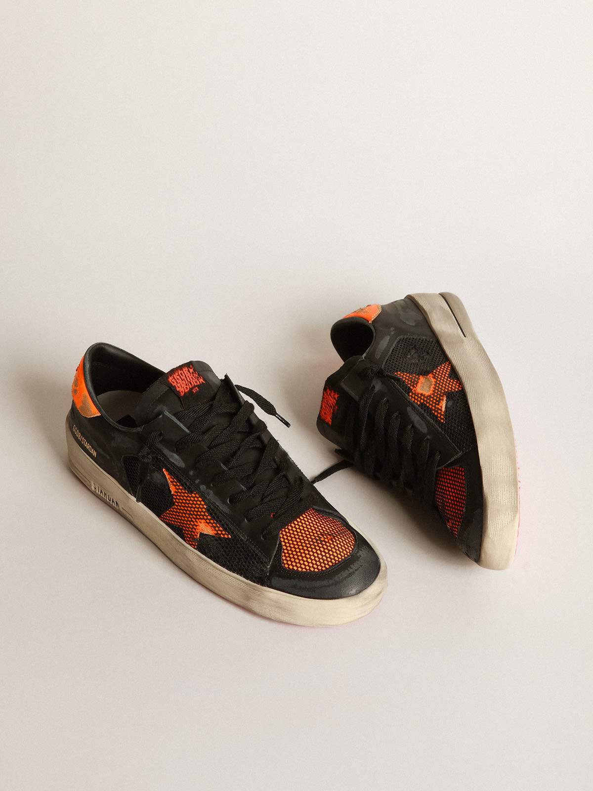 Golden Goose - Black and orange Stardan sneakers in 